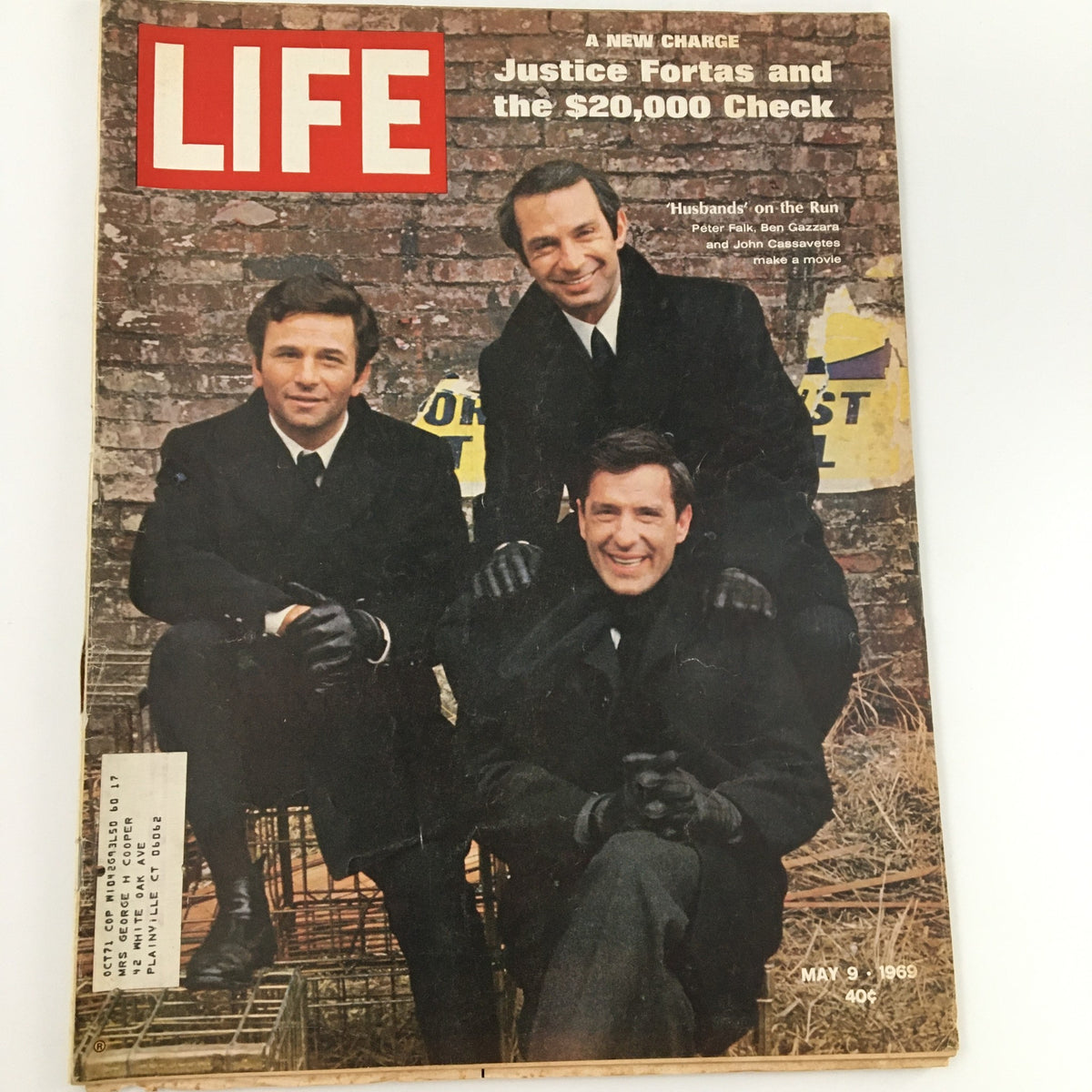 Cover of Life Magazine, dated May 9, 1969, featuring the title 'Justice Fortas and the $20,000 Check,' showcasing three men in black suits with gloves, set against a brick wall background.