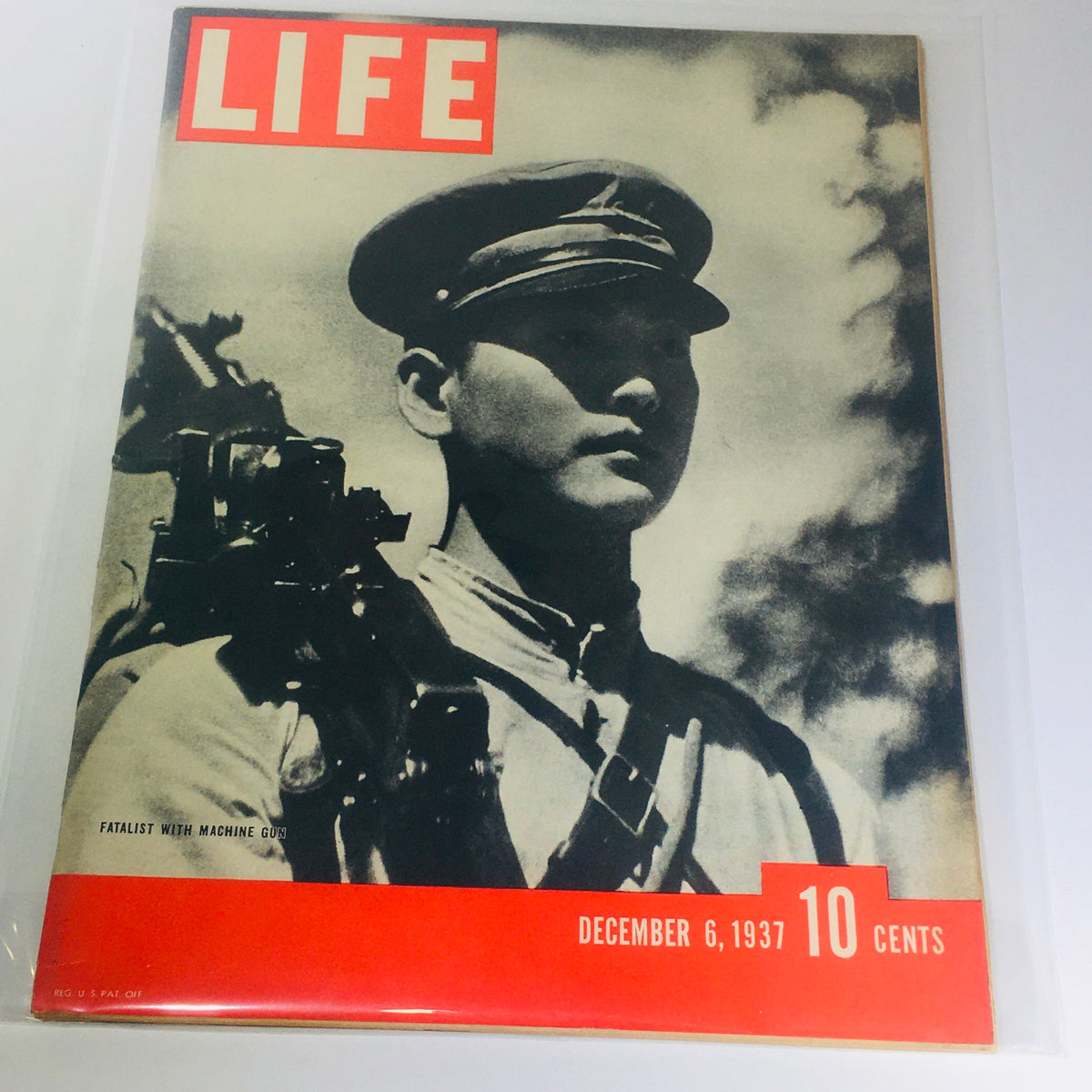 Vintage Life Magazine cover from December 6, 1937, titled 'Fatalist With Machine Gun', showcasing a soldier with a machine gun, perfect for collectors and history enthusiasts.
