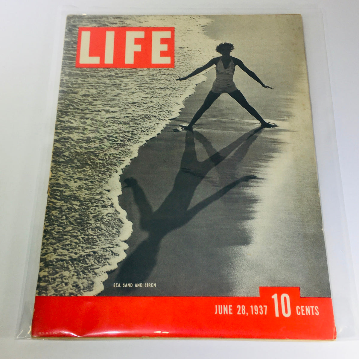 Cover of Vintage Life Magazine: June 28, 1937 - Sea, Sand And Siren featuring a person walking on the beach, showcasing the iconic era of leisure and lifestyle in the 1930s.