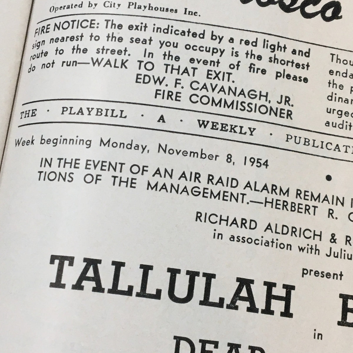 Detail of the 1954 Playbill from Morosco Theatre featuring Tallulah Bankhead in 'Dear Charles', showing production information and fire safety notice, a piece of vintage theatre memorabilia.