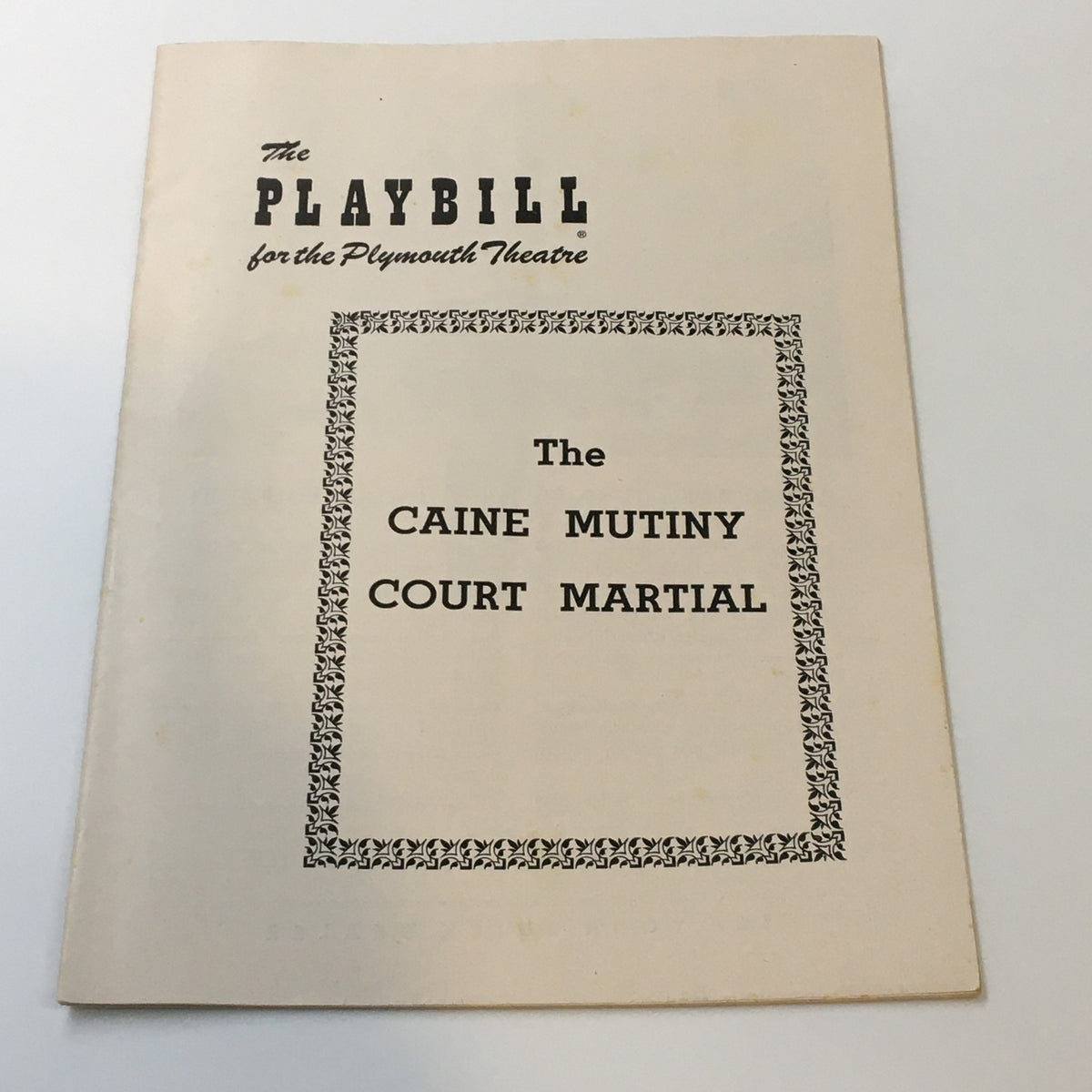 Cover of the 1954 Playbill for The Plymouth Theatre featuring Herman Wouk's The Caine Mutiny Court Martial, showcasing the title and decorative border.