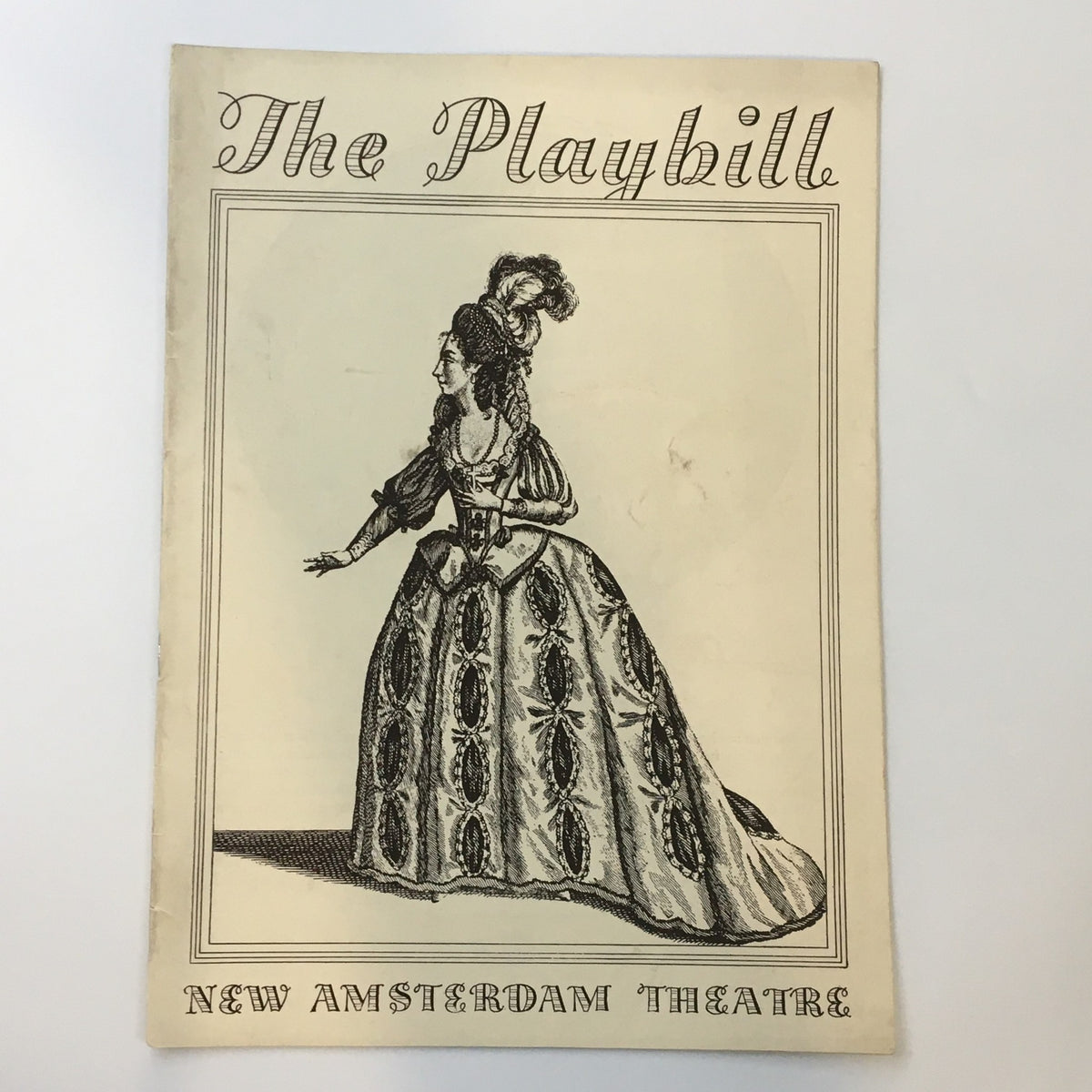 1935 Playbill from the New Amsterdam Theatre featuring Libby Holman in "Revenge with Music," showcasing an intricate cover design with a Victorian woman in a gown.
