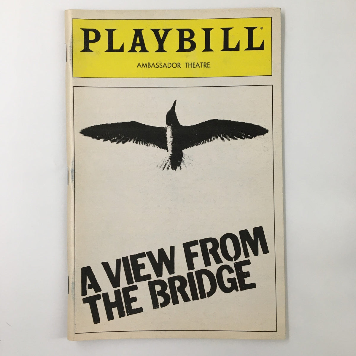 1983 Playbill for A View From The Bridge at the Ambassador Theatre, featuring a stylized design with a black silhouette of a bird and the title prominently displayed.