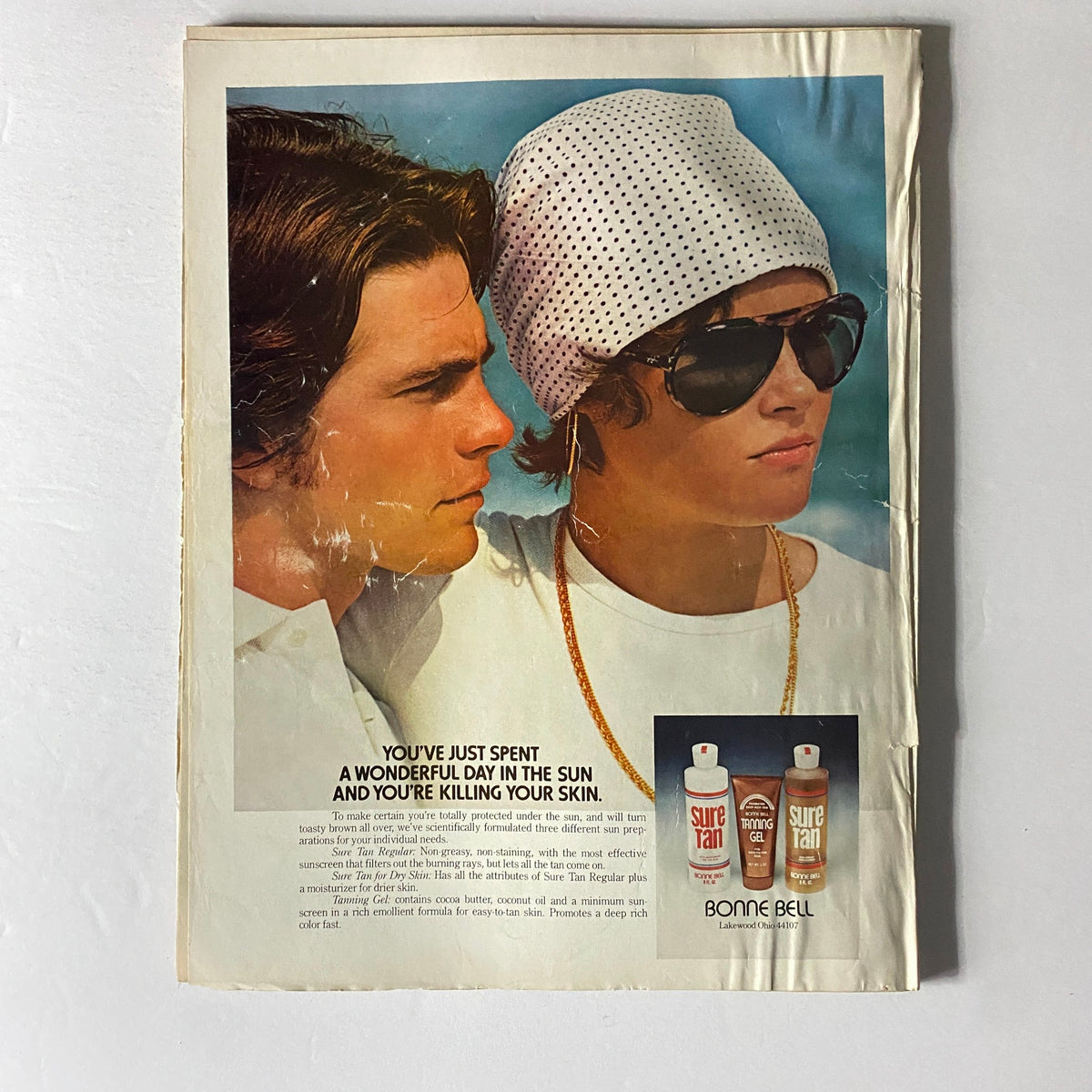 Back cover of Vogue Magazine July 1974 featuring an advertisement - Vintage advertisement showcasing sun care products, exemplifying 1970s advertising aesthetics.