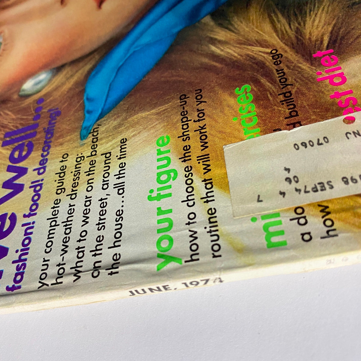 Close-up view of the Vogue Magazine June 1974 cover, highlighting the text and vibrant colors associated with fashion, health, and lifestyle trends.