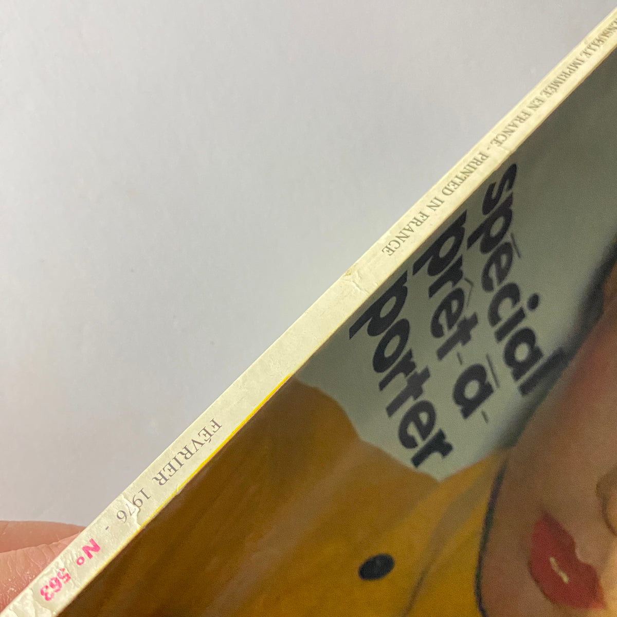 Side view of Vogue Paris Magazine February 1976, highlighting the vintage details and the title 'spécial prêt-à-porter', emphasizing its collectible nature.