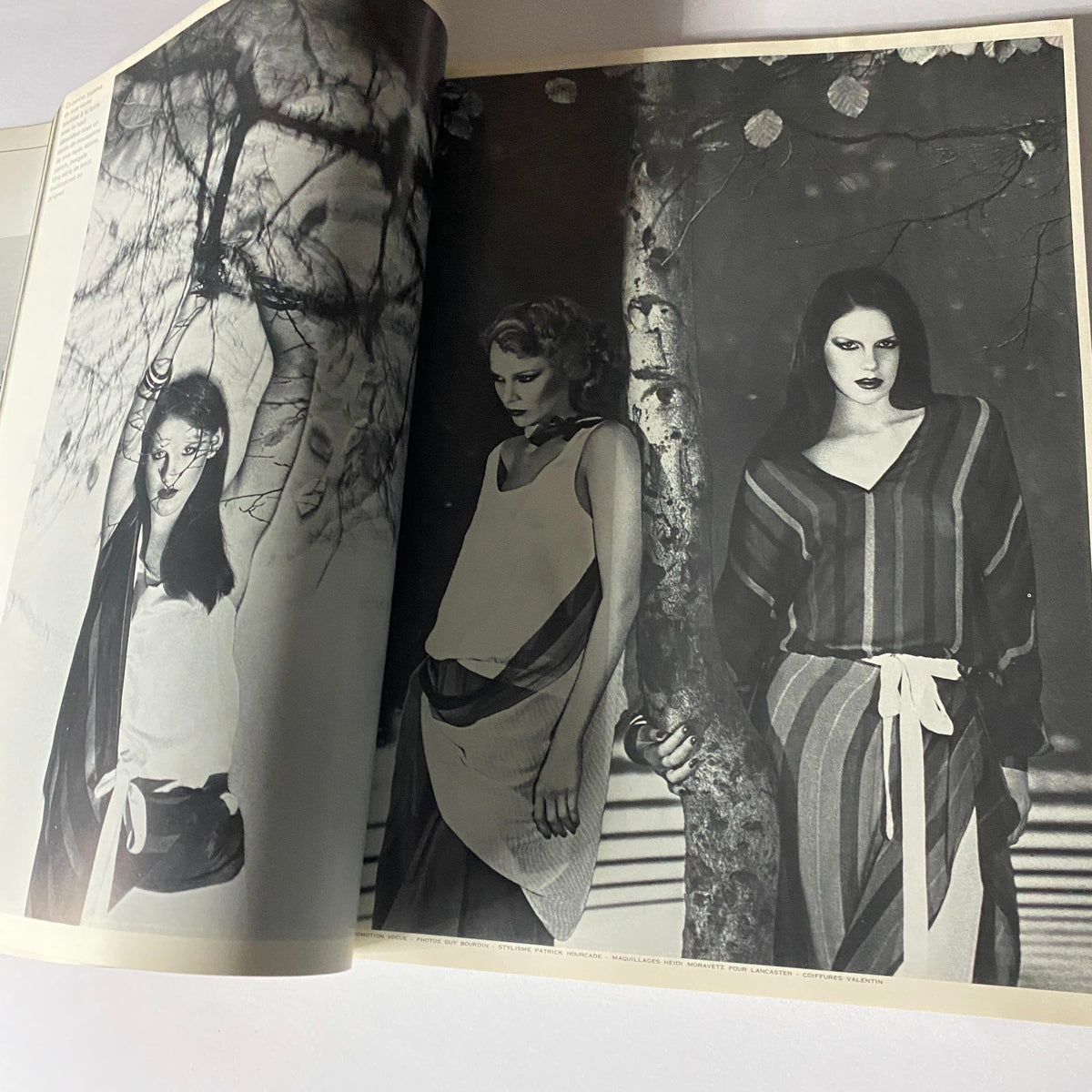 Fashion editorial page from Vogue Paris Magazine February 1976, displaying models in 1970s styles and rich monochromatic visuals.