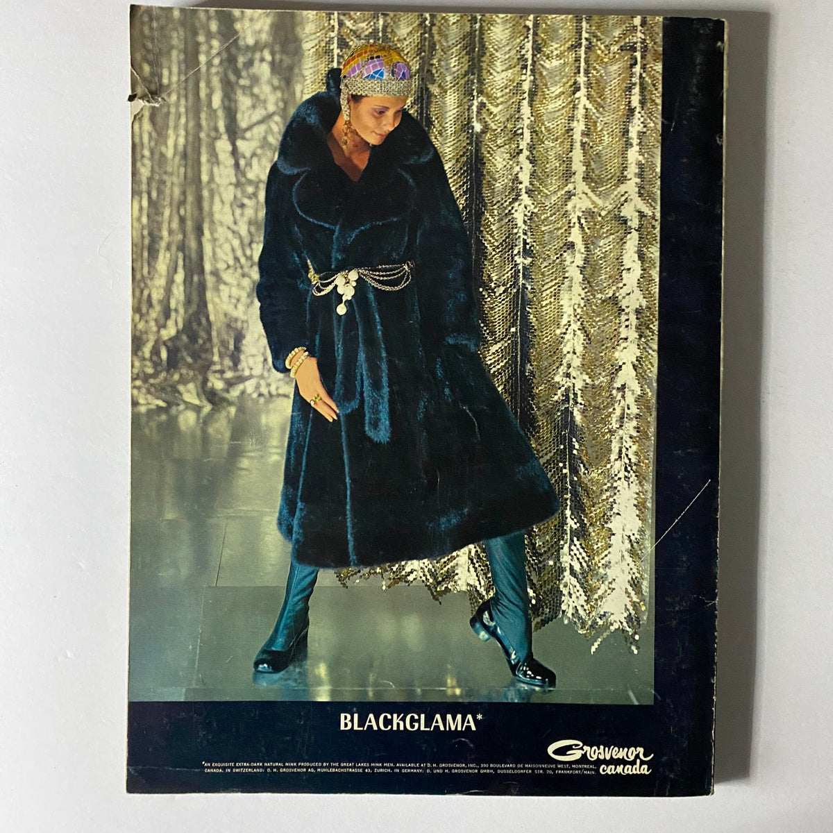 Cover of Blackglama advertisement featuring a model in luxurious fur coat against a shiny backdrop, included in Vogue Paris Magazine May 1970.