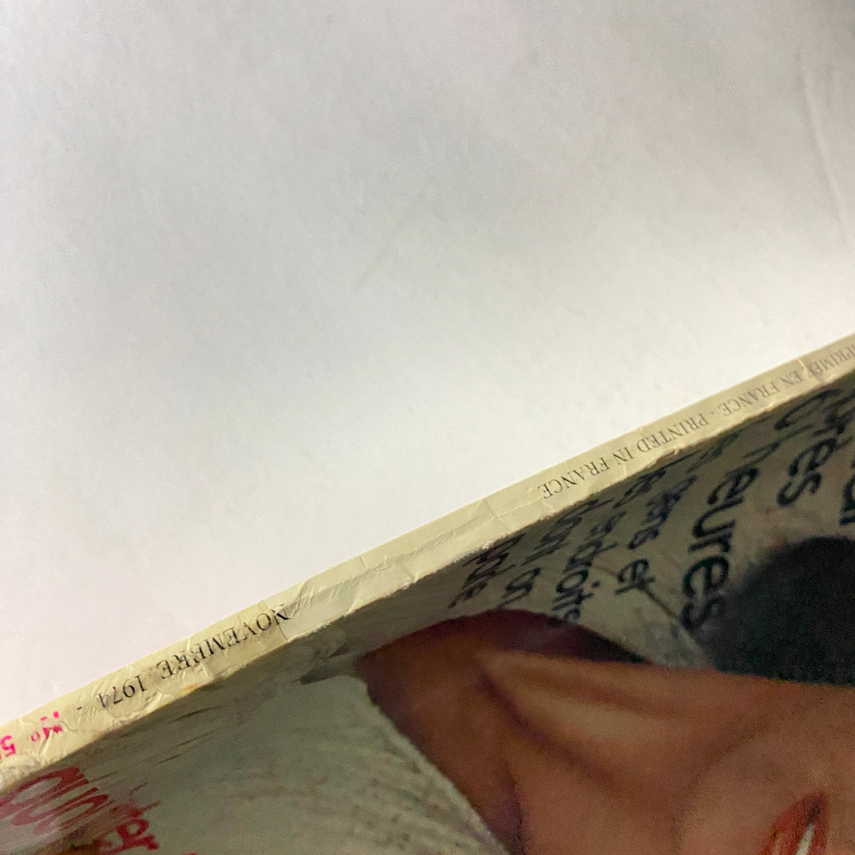 Side view of the Vogue Paris Magazine November 1974 showcasing the spine with printed details, including the publication date and country of origin.