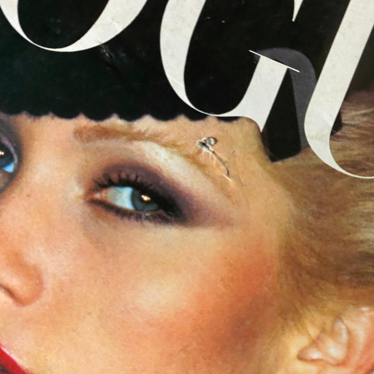 Close-up view of the Vogue Paris Magazine cover from September 1974, highlighting Anna Andersen's striking eyes and vintage makeup.