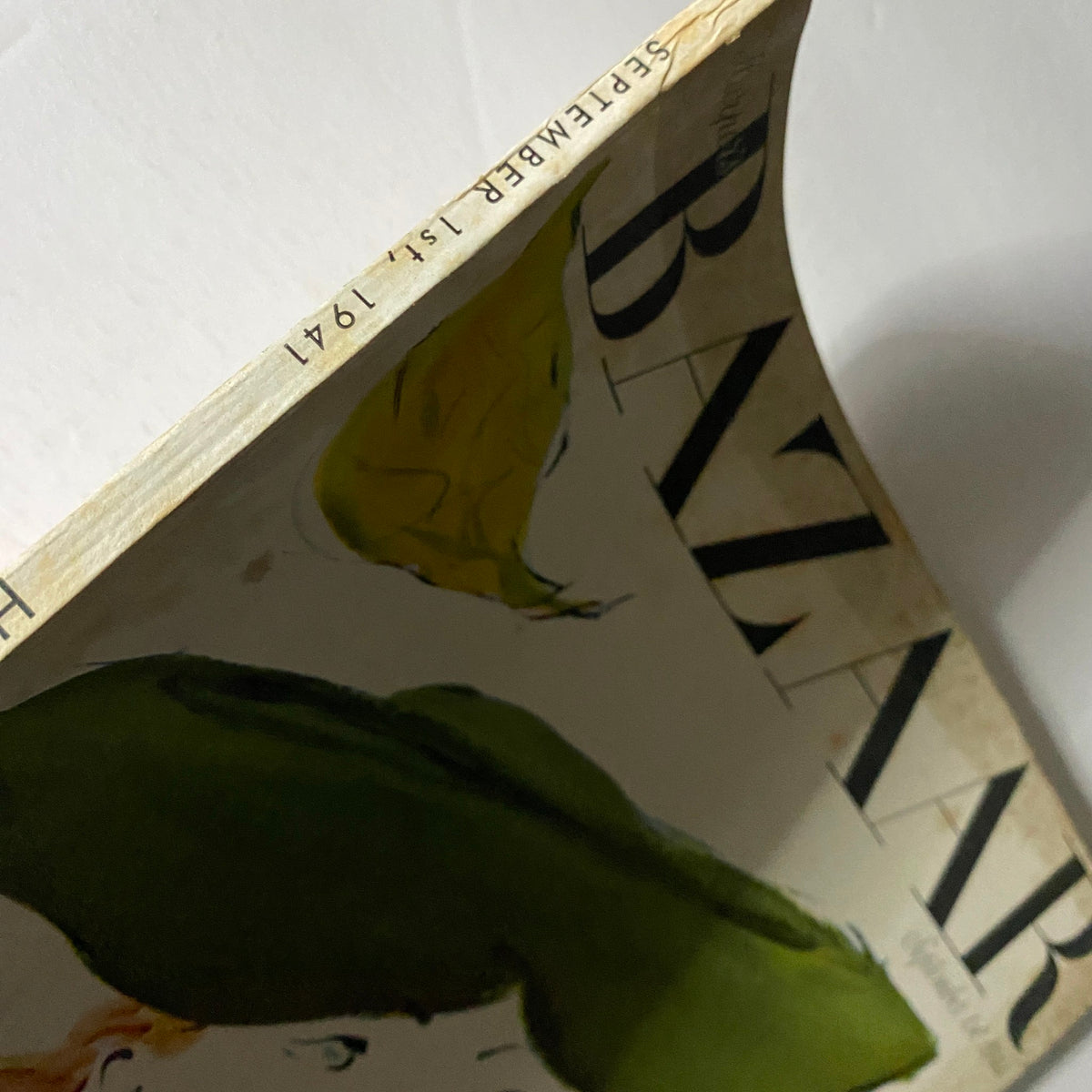 Side view of the Harper's Bazaar Magazine September 1, 1941 showing the cover with a painted woman in a green hat. The magazine displays light wear typical for its age, reflecting its vintage nature.