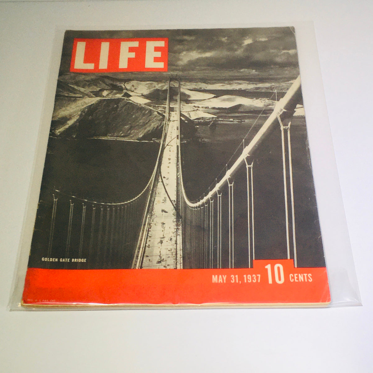 Vintage Life Magazine cover featuring the Golden Gate Bridge, dated May 31, 1937. This iconic image showcases an important piece of American history with vibrant colors and unique design.