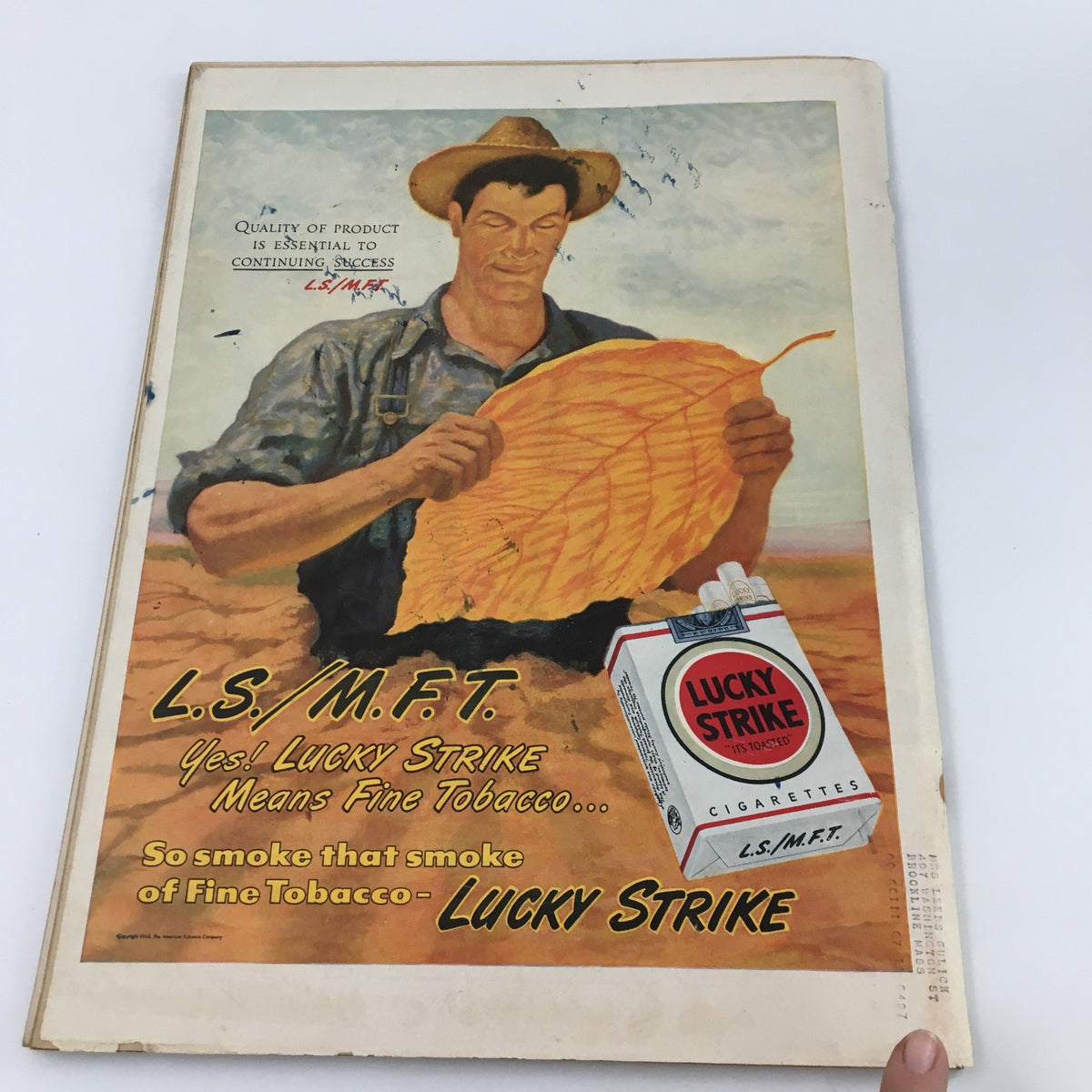 Vintage advertisement from the 1940s for Lucky Strike cigarettes, featuring a farmer holding a large tobacco leaf, promoting the quality of fine tobacco. Part of the Life Magazine September 23, 1946 issue, which includes a feature on cats and dachshunds.