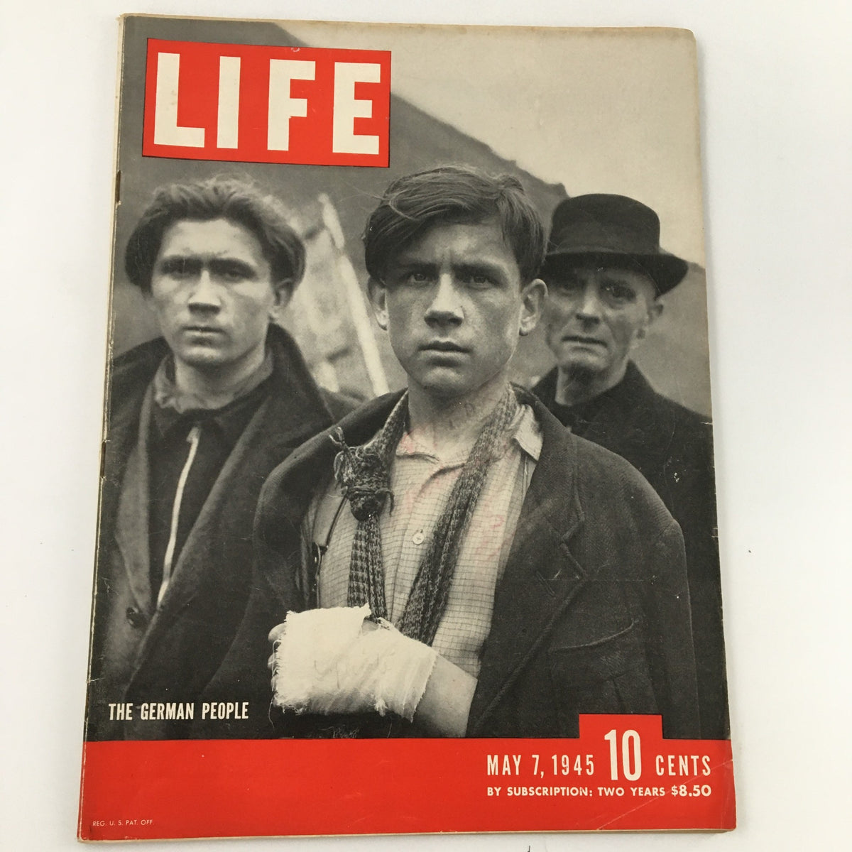 Cover of VTG Life Magazine from May 7, 1945, featuring 'The German People' photographed during WWII, showcasing three somber individuals in front of a dramatic backdrop.