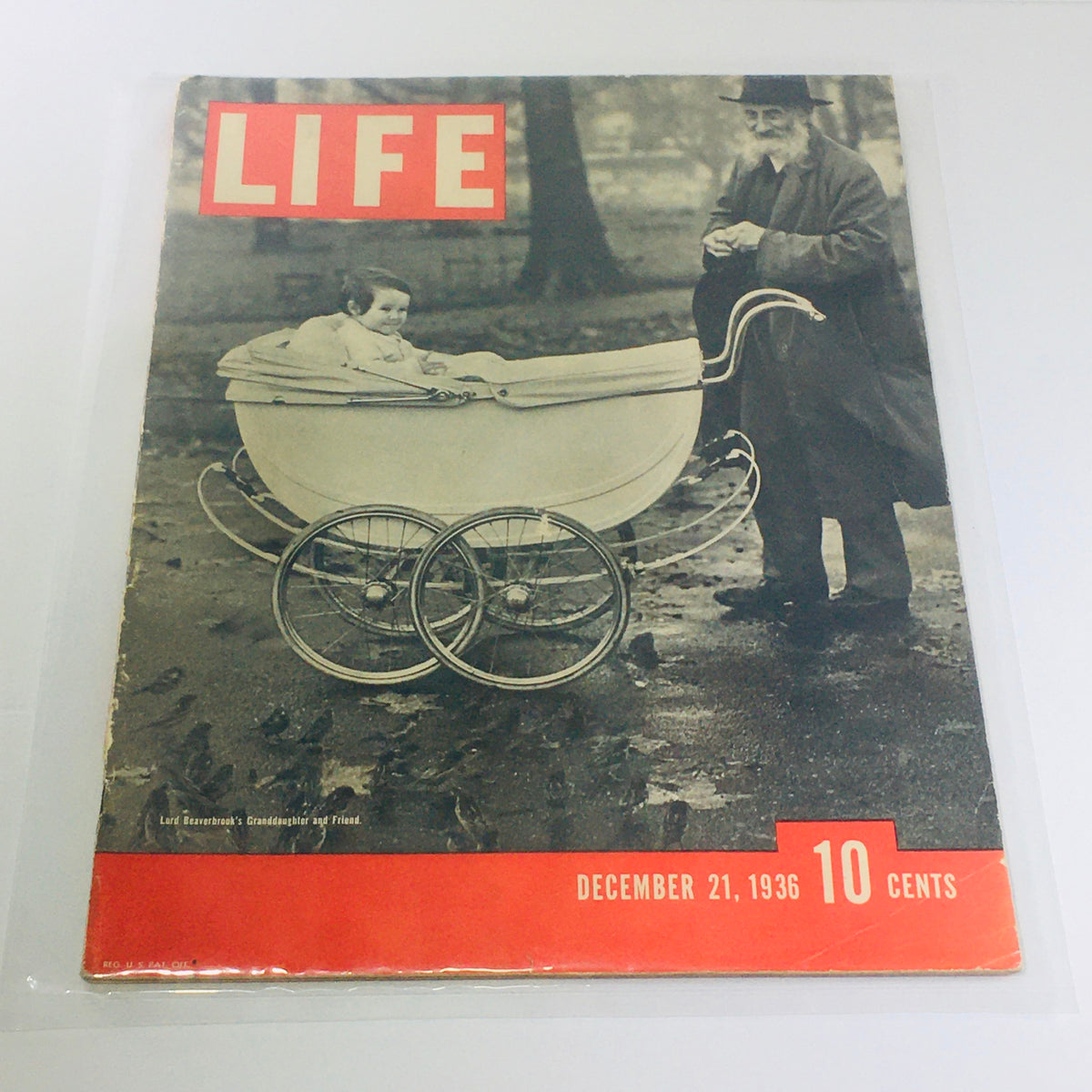 Cover of Vintage Life Magazine from December 21, 1936, featuring Lord Beaverbrook's Granddaughter and Friend, showcasing a charming historical scene with a baby in a stroller beside an elderly man, illustrating 1930s culture.