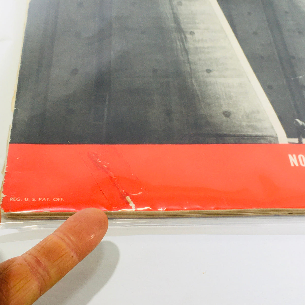 Close-up of the side edge of the Vintage Life Magazine from November 23, 1936, displaying visible wear and tear, highlighting its antique condition.