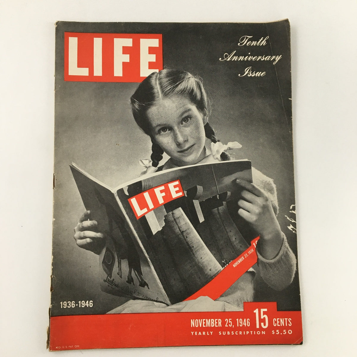 Vintage Life Magazine November 25, 1946 Tenth Anniversary Issue featuring a girl with pigtails reading the magazine, showcasing its iconic design and historical significance.