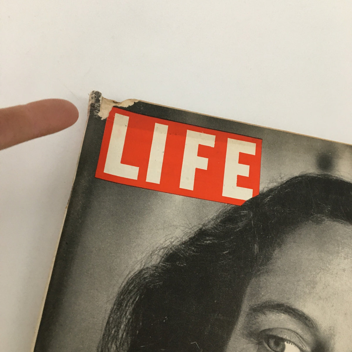 Close-up of the cover of Life Magazine dated December 16, 1946, featuring a damaged corner and the iconic title 'LIFE' above a portrait of American actress Teresa Wright.