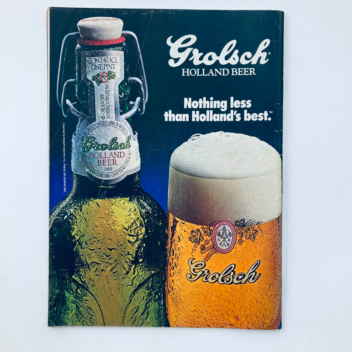 Back cover of Vintage National Lampoon Magazine July 1985, highlighting an advertisement for Grolsch Holland Beer, reflecting retro advertising style.