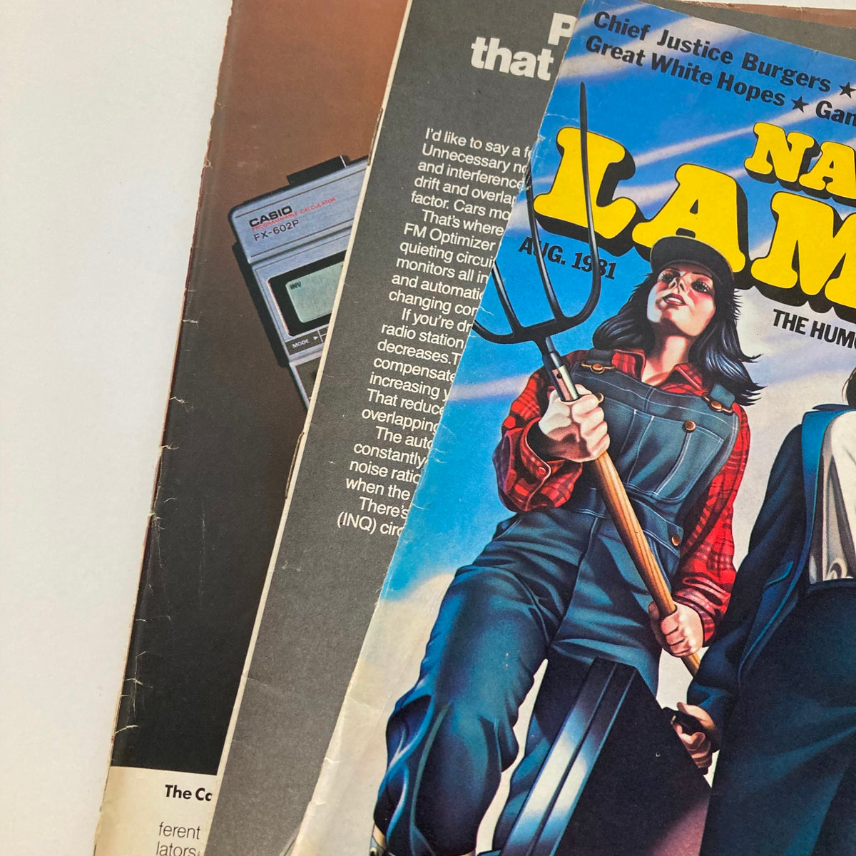 Close-up of Vintage National Lampoon Magazine August 1981 cover, showcasing a woman holding a pitchfork, and highlighting the magazine's themes of humor and satire.