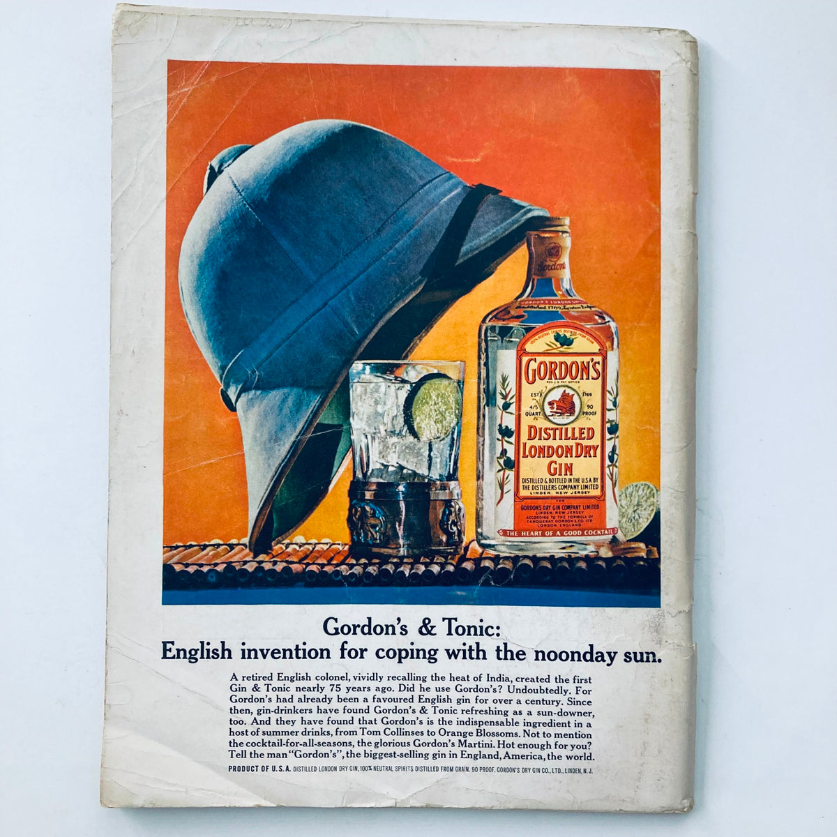 Back cover of VTG Playboy Magazine June 1963 advertising Gordon's Dry Gin, featuring a vintage illustration of a helmet and a cocktail.