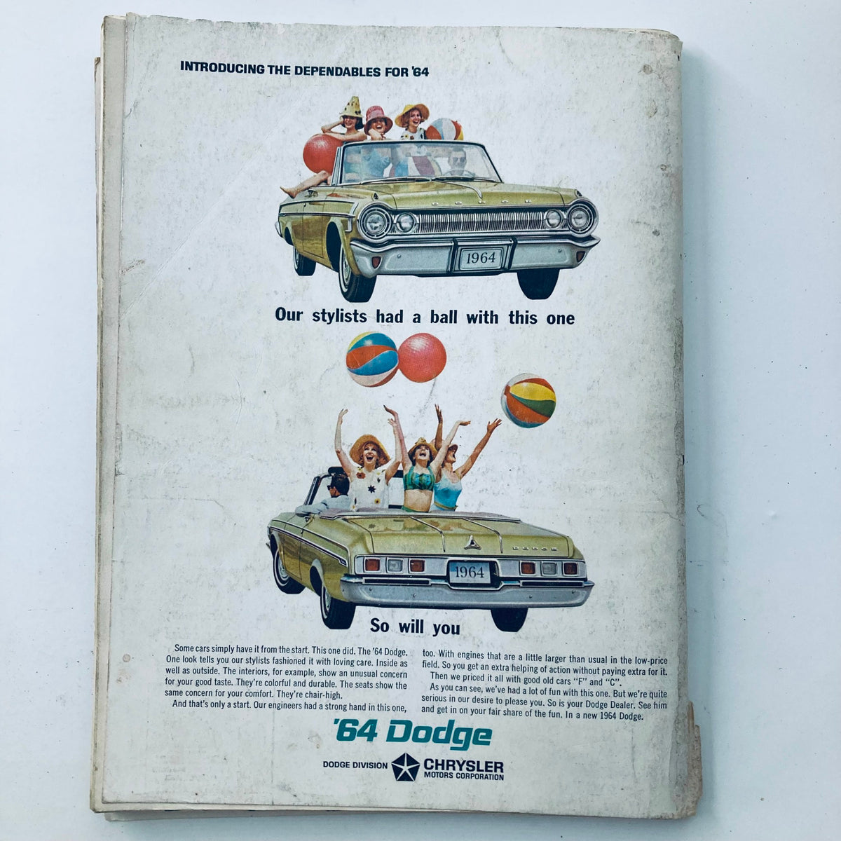 Back cover of VTG Playboy Magazine December 1963 with a vintage advertisement for a 1964 Dodge featuring playful women and beach balls.