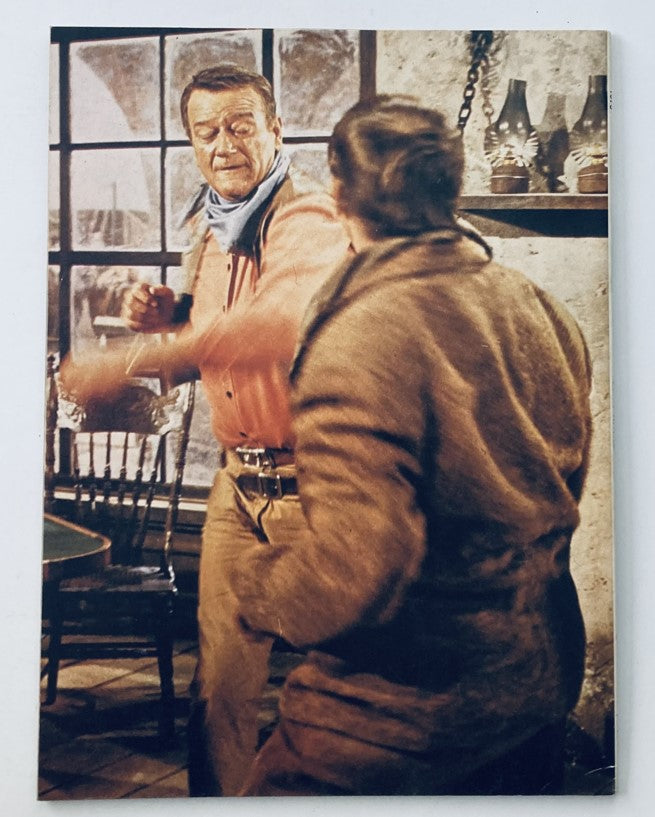 Vintage 1979 John Wayne Duke's Own Story Collector's Edition illustration depicting a scene with John Wayne in action, showcasing the iconic Western genre, suitable for collectors or fans of classic cinema.