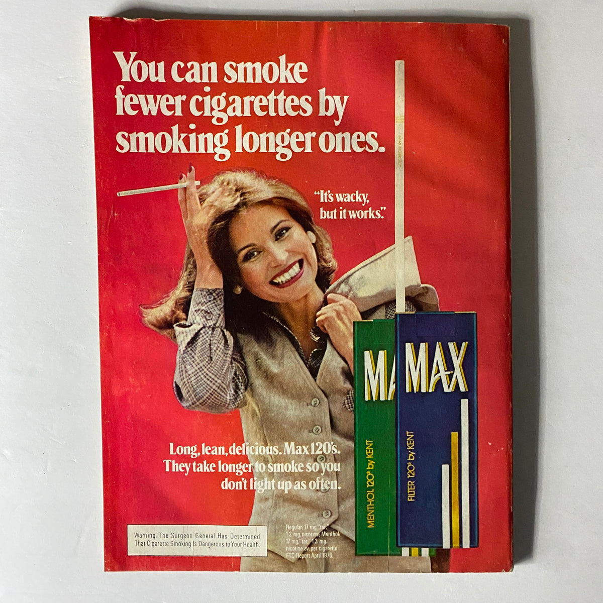 Vintage advertisement from Harper's Bazaar Magazine March 1977 featuring a smiling woman promoting Max 120's cigarettes with the tagline 'You can smoke fewer cigarettes by smoking longer ones.' The ad showcases the fashion and style of the 1970s.