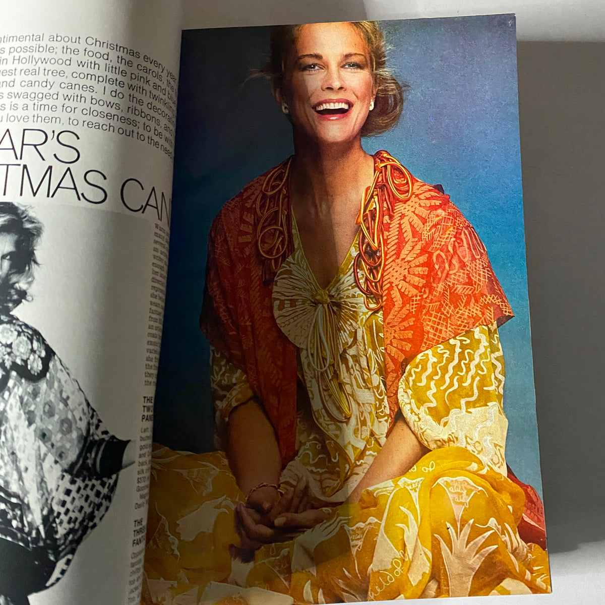 Fashion editorial from Harper's Bazaar Magazine December 1977 showcasing a smiling model wearing festive attire, emphasizing holiday fashion trends.