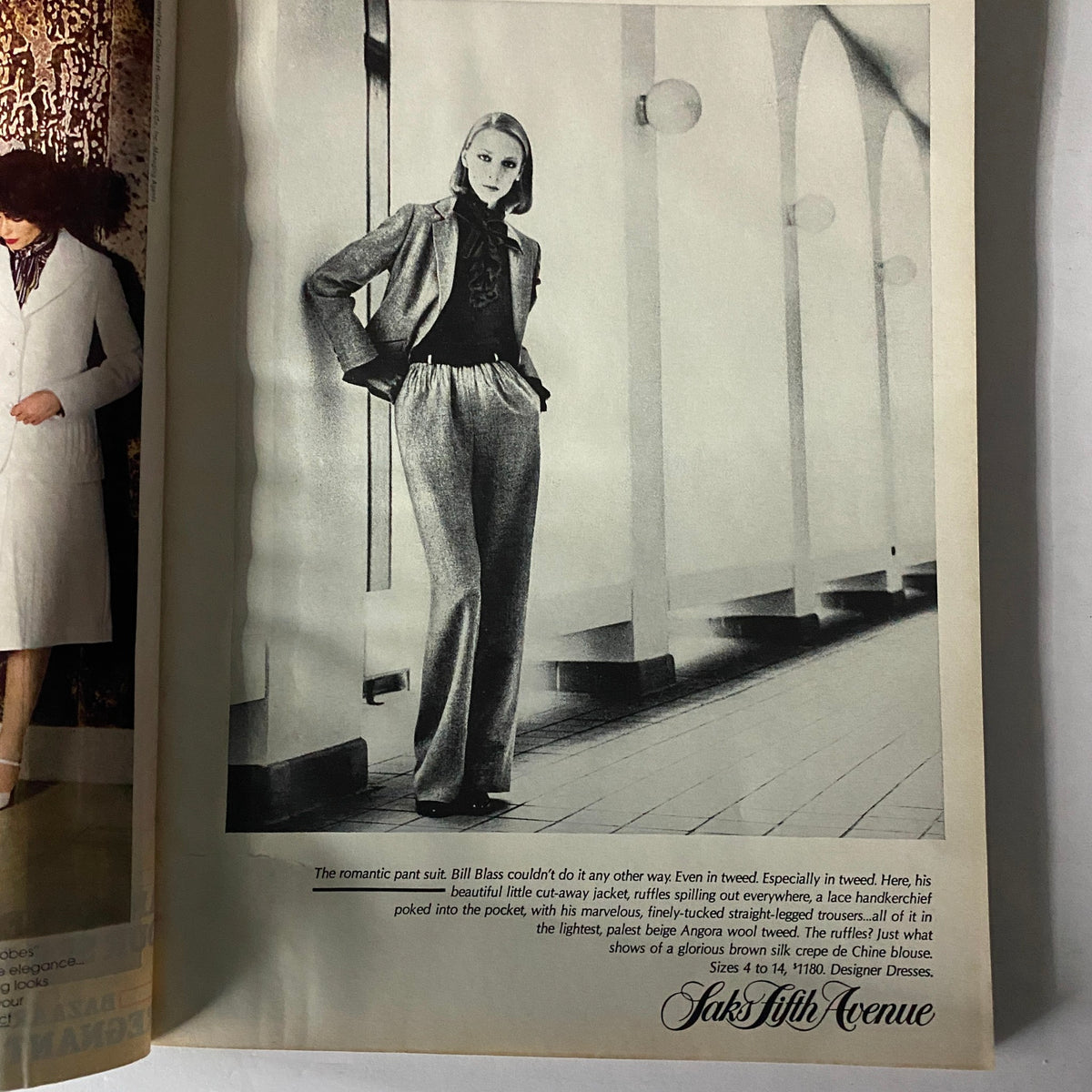 Fashion advertisement from Harper's Bazaar Magazine February 1978 showcasing a stylish suit from Saks Fifth Avenue.