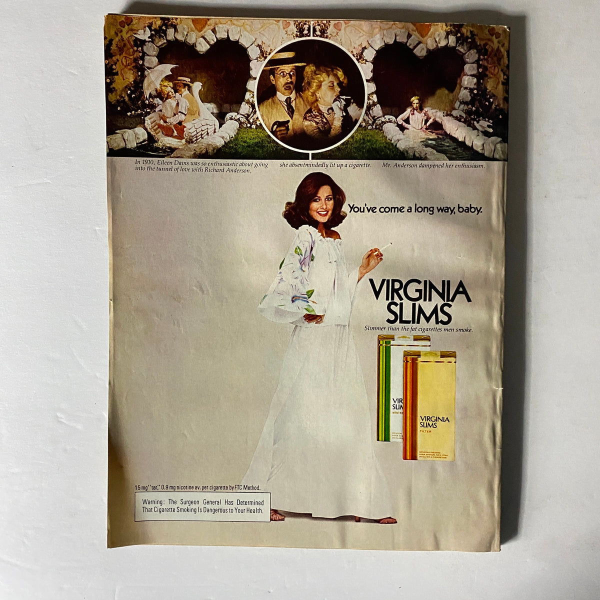Back cover advertisement from Harper's Bazaar January 1979 for Virginia Slims cigarettes, showcasing a woman in a flowy outfit holding a cigarette, with a nostalgic design.