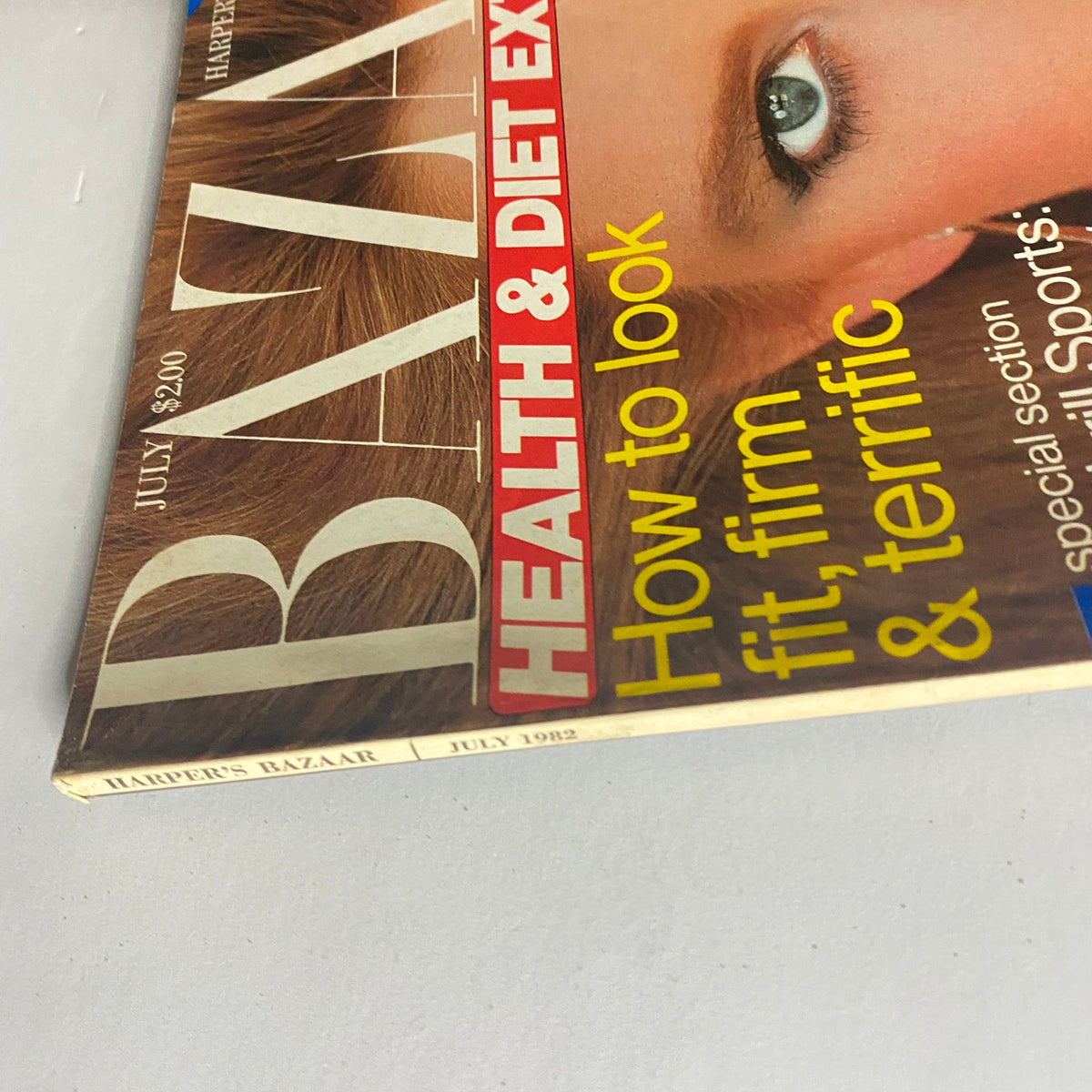 Close-up view of Harper's Bazaar Magazine July 1982, showcasing the title and focus on health and dieting tips, emphasizing the magazine's vintage appeal.