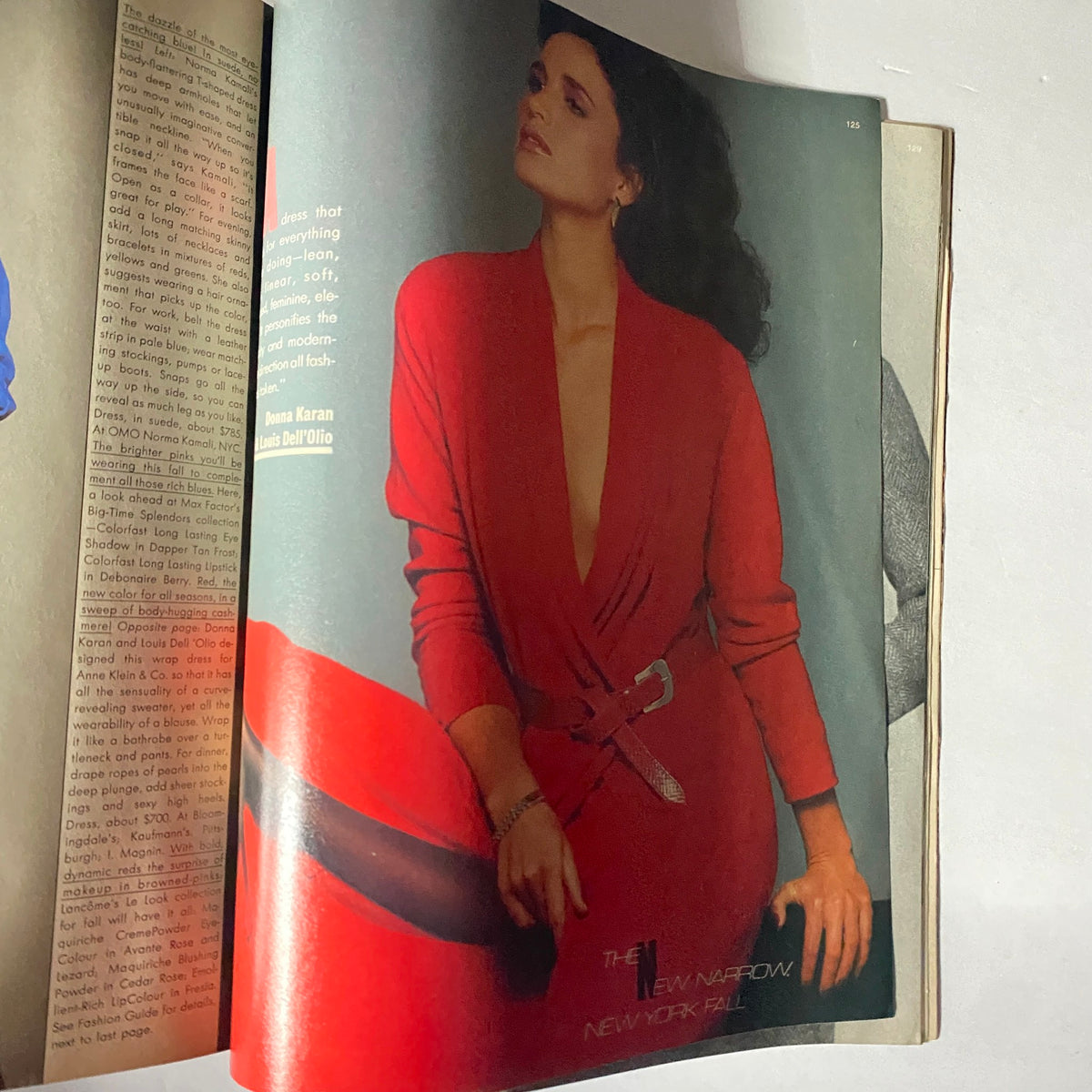 Harper's Bazaar Magazine July 1982 feature, showcasing a model in a striking red outfit with a deep neckline, symbolizing 1980s fashion trends.