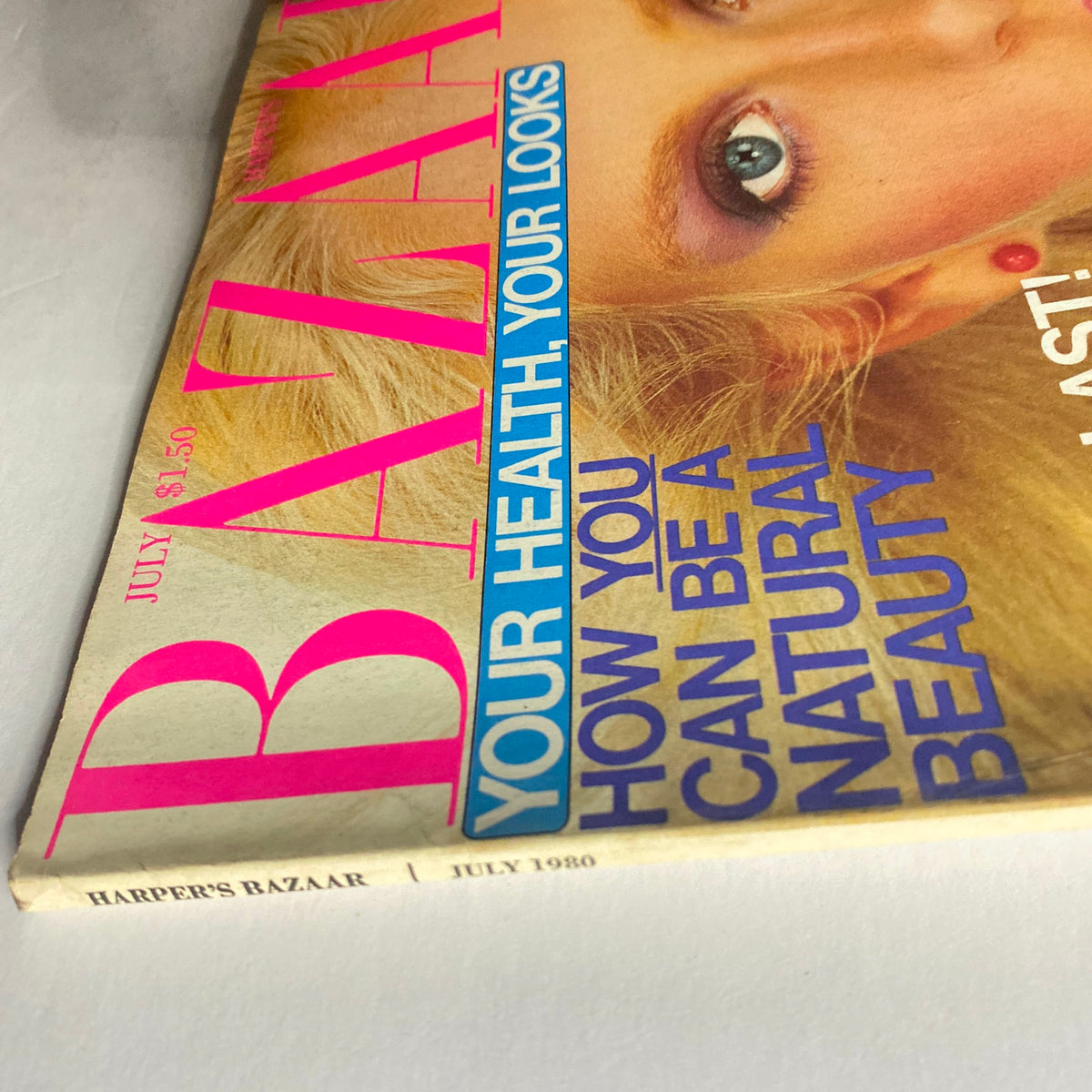 Cover of Harper's Bazaar Magazine July 1980 featuring vibrant text and natural beauty theme.
