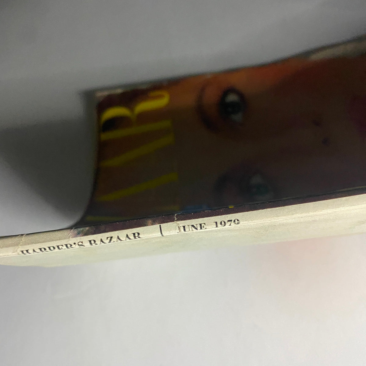 Side view of Harper's Bazaar Magazine June 1979, highlighting the magazine title and publication date, a collectible piece of fashion history.