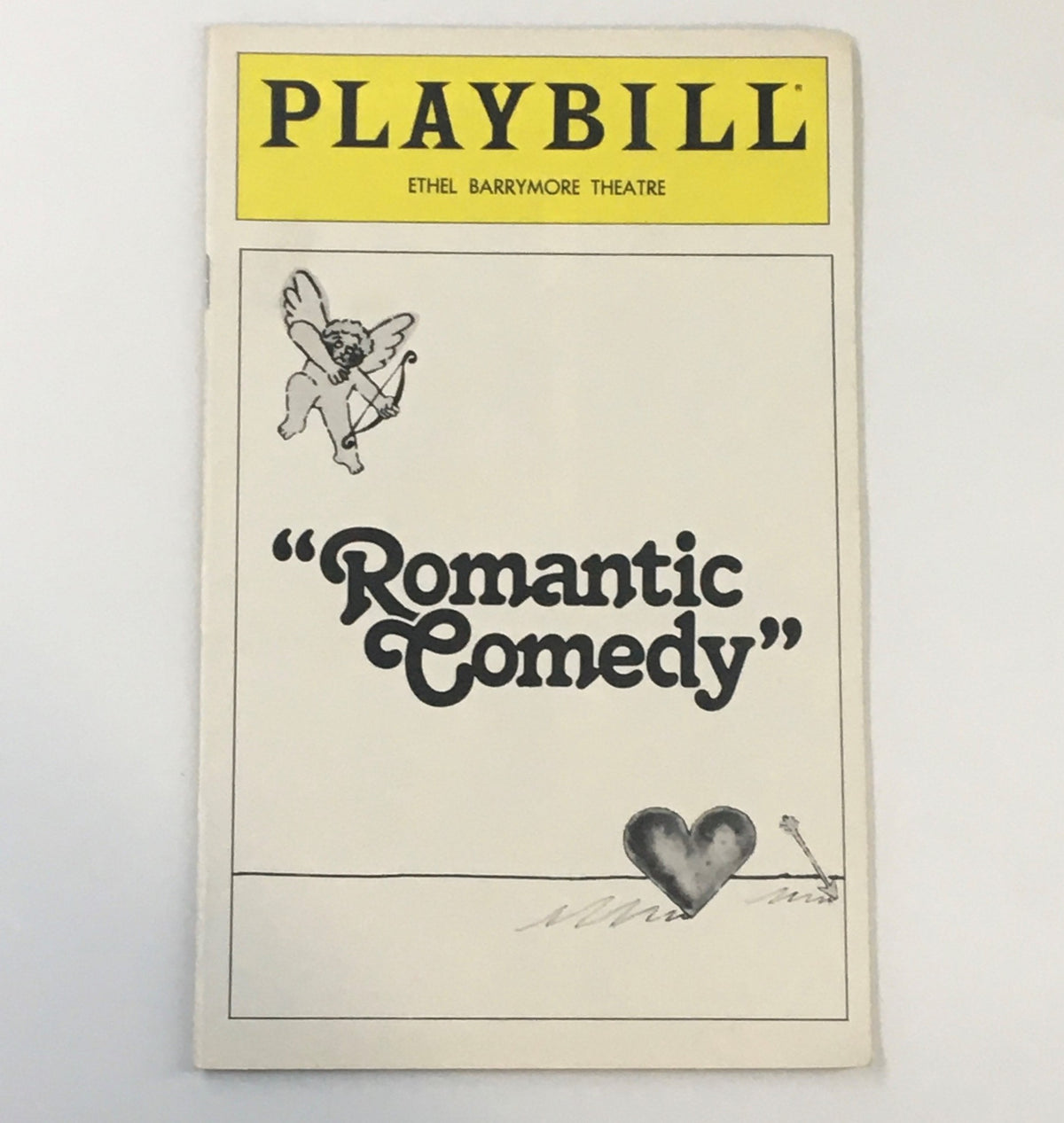 1980 Playbill for the Ethel Barrymore Theatre featuring the title 'Romantic Comedy', showcasing a playful design including a cupid and decorative heart imagery.