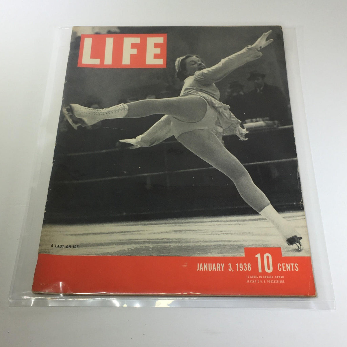 Vintage Life Magazine cover from January 3, 1938, titled 'A Lady On Ice,' showcasing a figure skater in motion, highlighting vintage graphic design and historical significance.