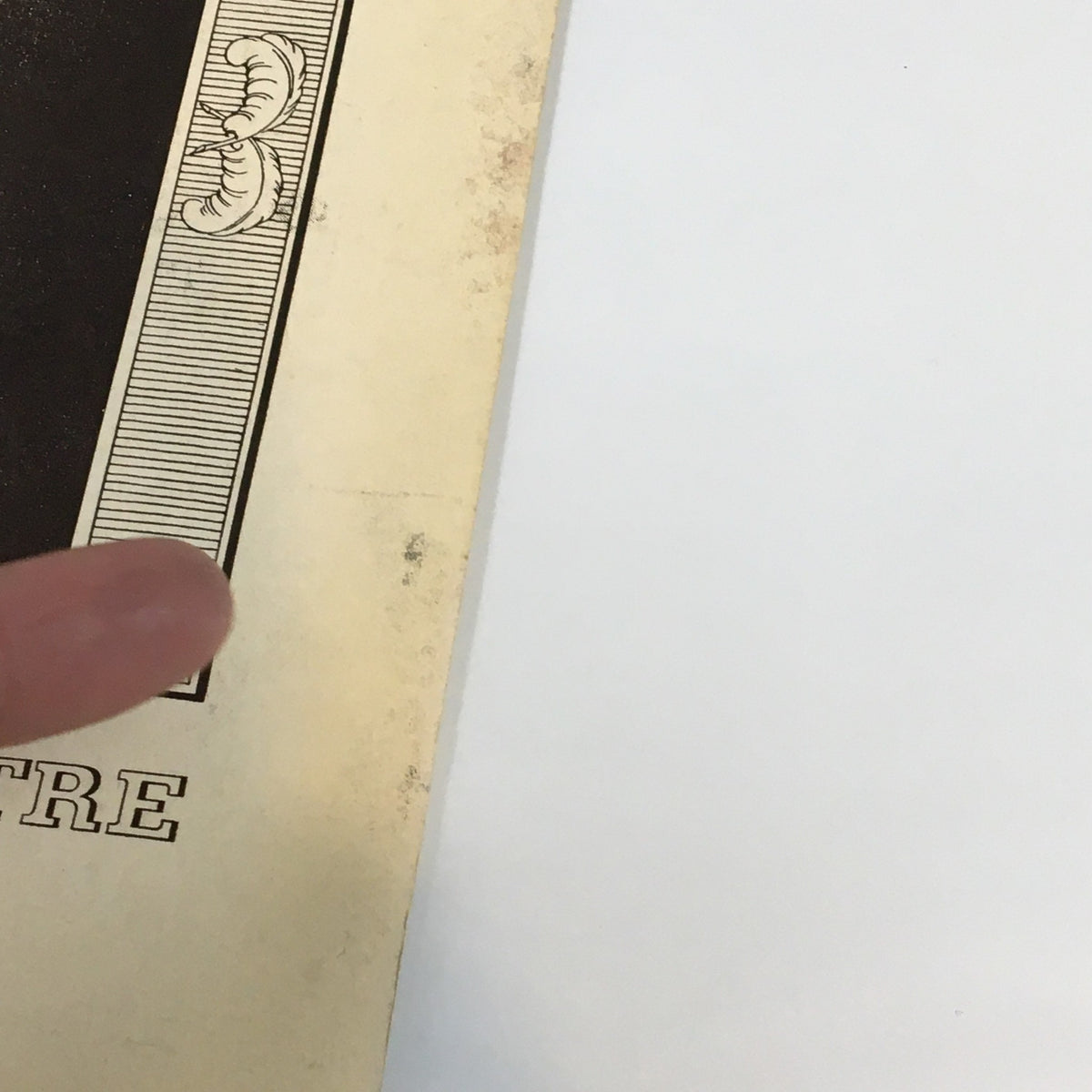 Detail view of the 1938 Playbill for 'On Borrowed Time' by Paul Osborn, highlighting the Longacre Theatre logo and edge wear of the vintage playbill.