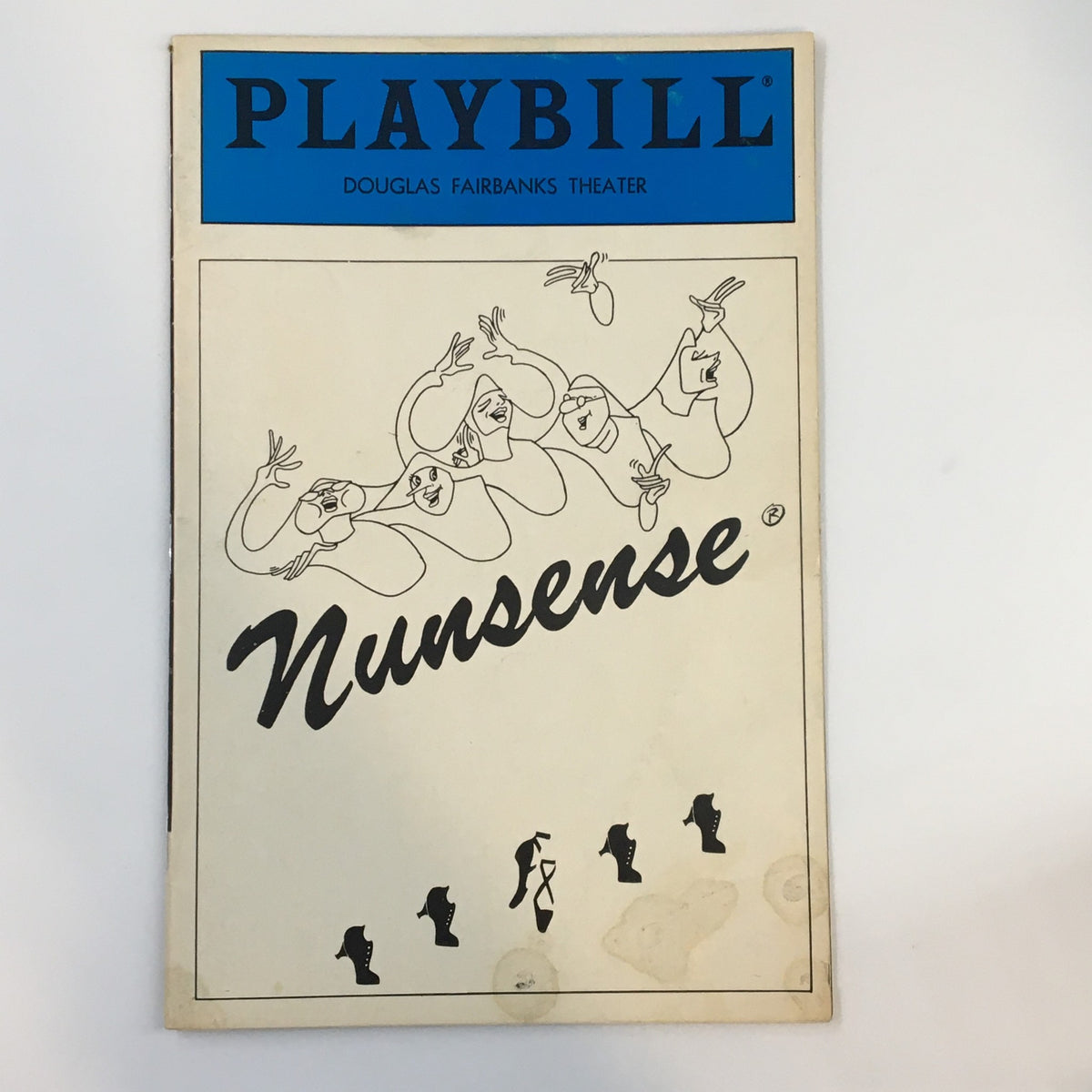 1986 Playbill from Douglas Fairbanks Theater featuring Nunsense, showcasing a whimsical illustration of the cast.