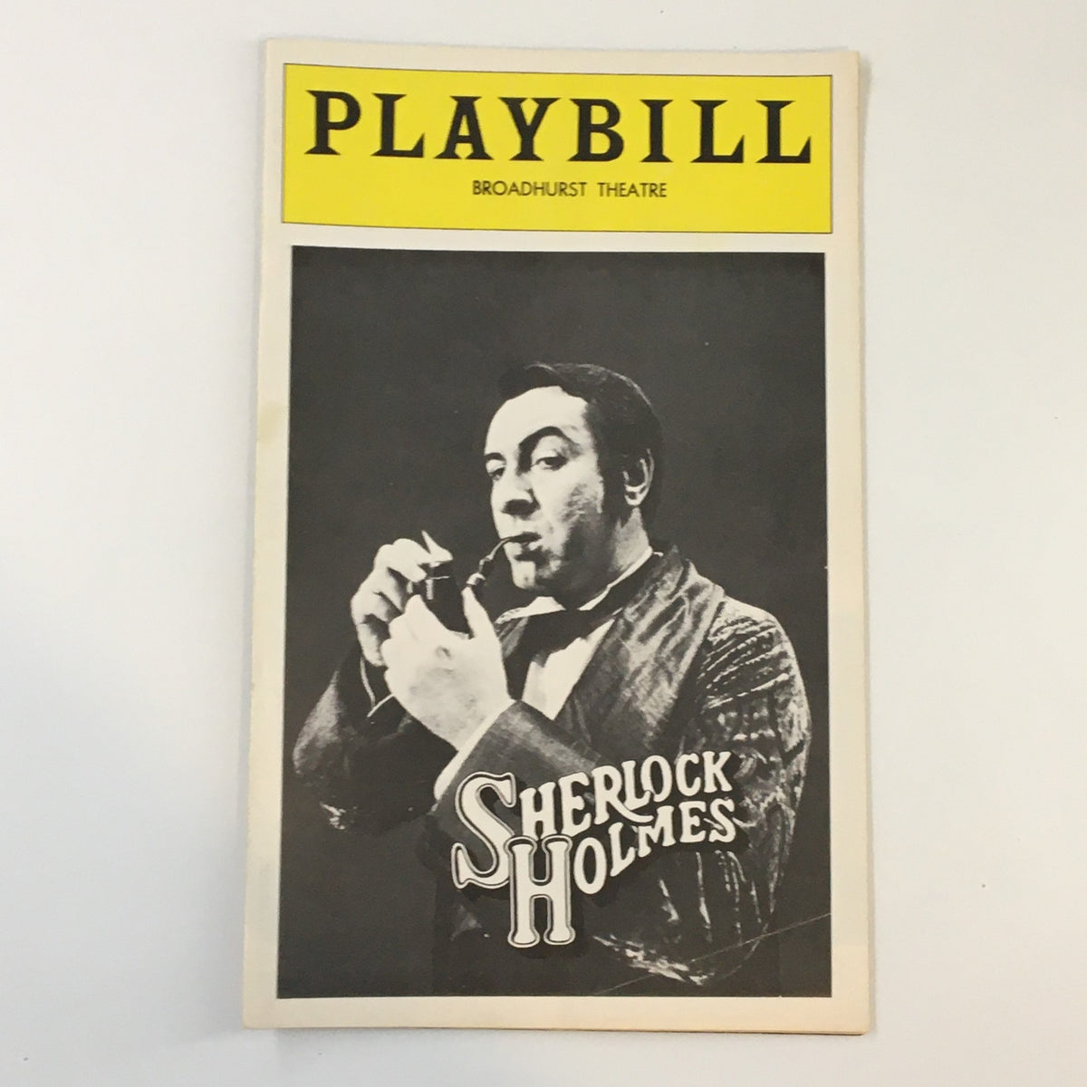 1975 Playbill Broadhurst Theatre featuring Robert Stephens as Sherlock Holmes, showcasing the iconic cover design with a black and white photo of the actor.