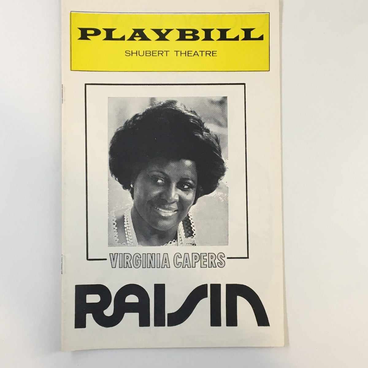 1975 Playbill from Shubert Theatre featuring Virginia Capers in the production of Raisin, showcasing the cover design and iconic style of the era.