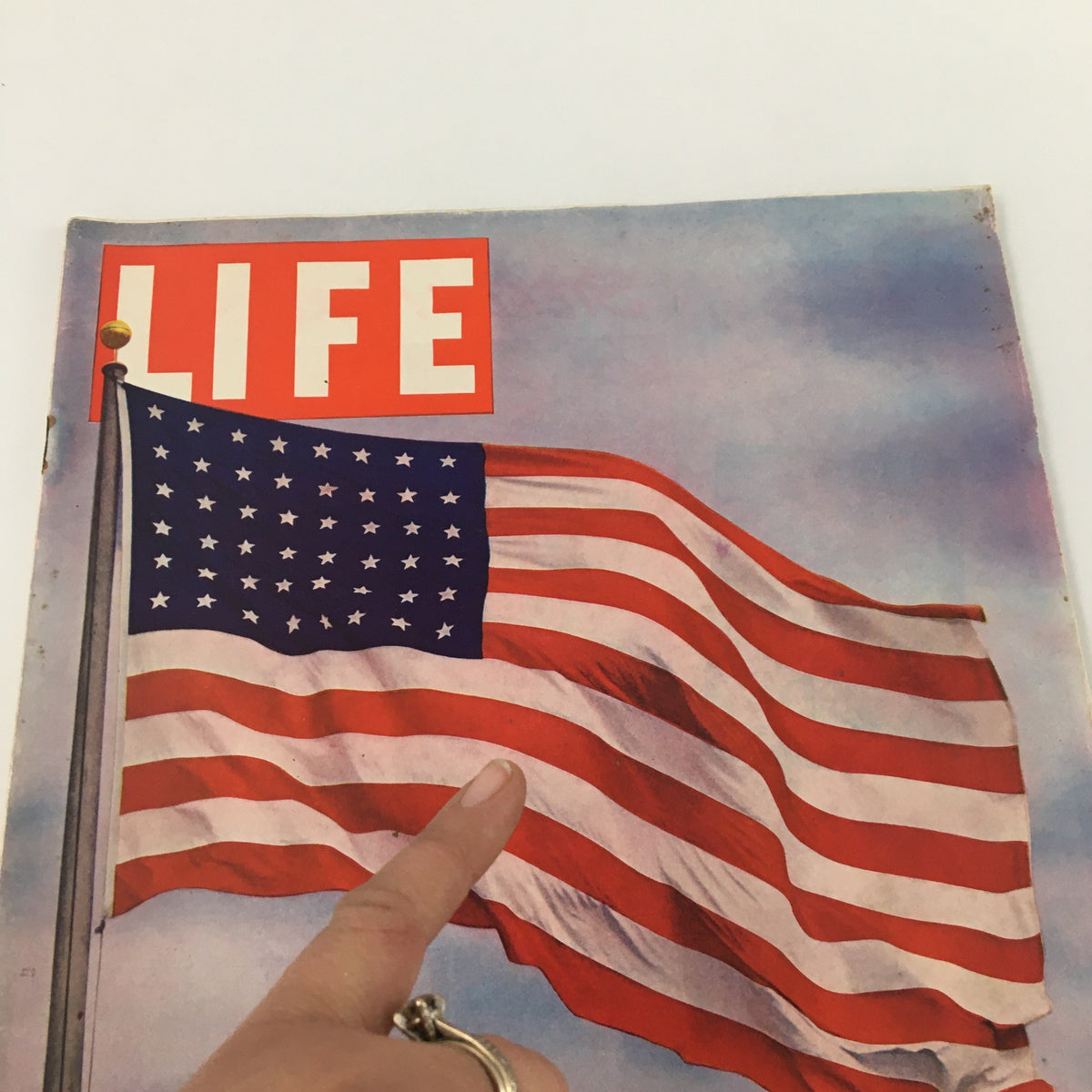 Close-up view of the cover of VTG Life Magazine July 6 1942, highlighting the Flag of the United States and the title 'LIFE'.