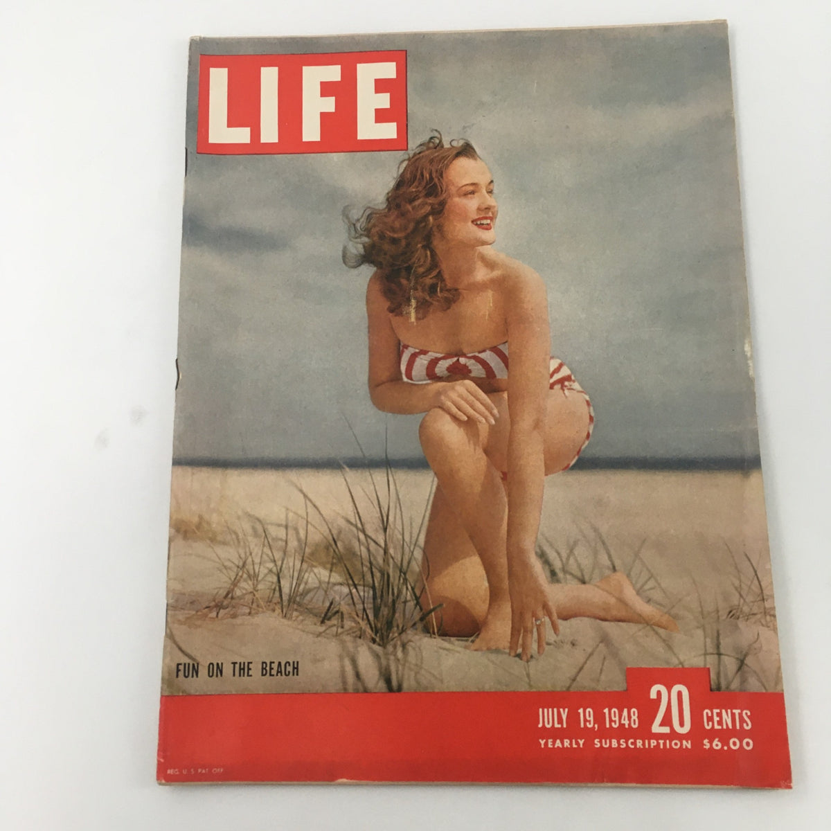 Cover of VTG Life Magazine July 19, 1948 featuring the article 'Fun On The Beach' with a woman in a striped swimsuit enjoying the beach.