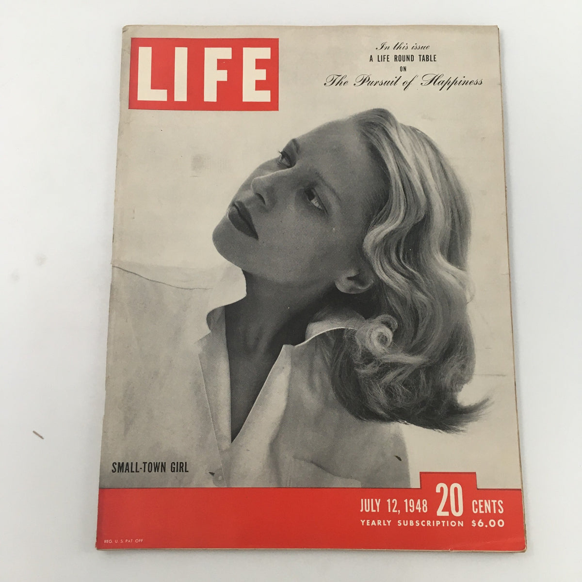 Vintage Life Magazine from July 12, 1948 featuring the cover story 'Small-Town Girl, The Pursuit of Happiness'. The magazine showcases a woman with wavy hair looking thoughtfully off to the side against a simple background.