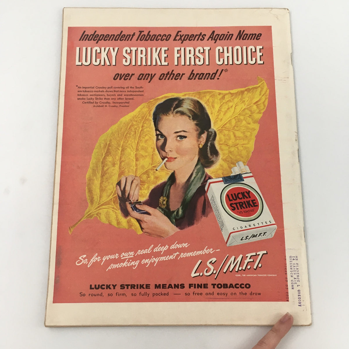 Back cover of the Vintage Life Magazine July 12, 1948, displaying an advertisement for Lucky Strike cigarettes, featuring a woman holding a cigarette and a pack of cigarettes. The ad is colorful and highlights the brand's tagline.