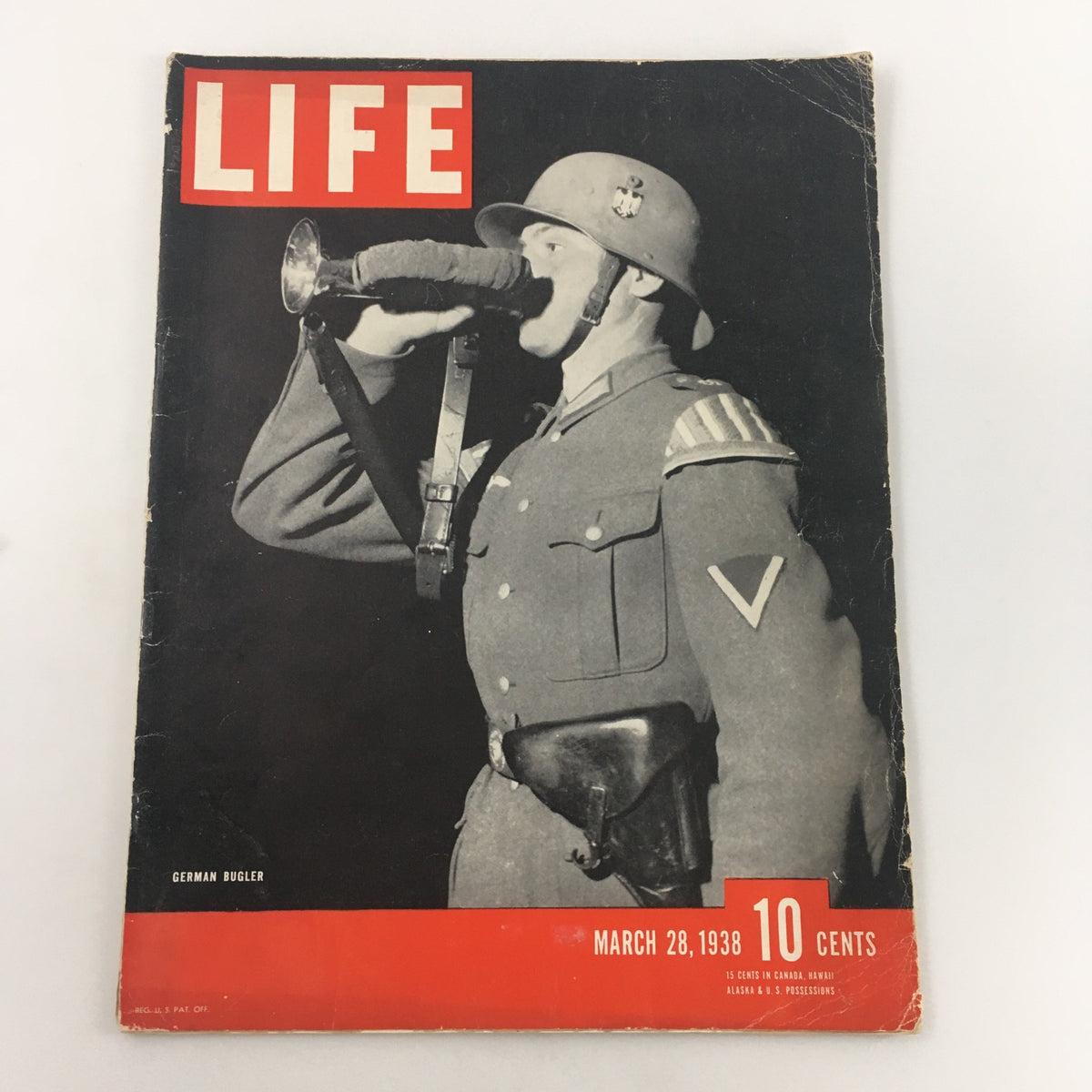 Cover of VTG Life Magazine March 28 1938 featuring a striking photograph of a German bugler in military uniform, showcasing historical significance and vintage photography.