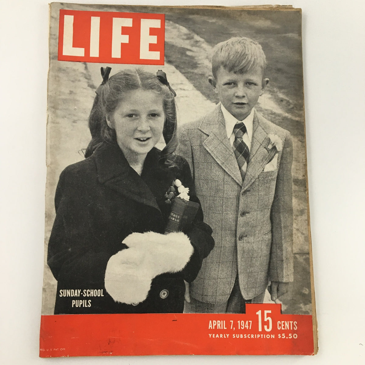 Cover of Life Magazine from April 7, 1947, depicting Sunday-school pupils, showcasing a vintage photograph with a girl in a black coat and a boy in a suit holding a Bible.