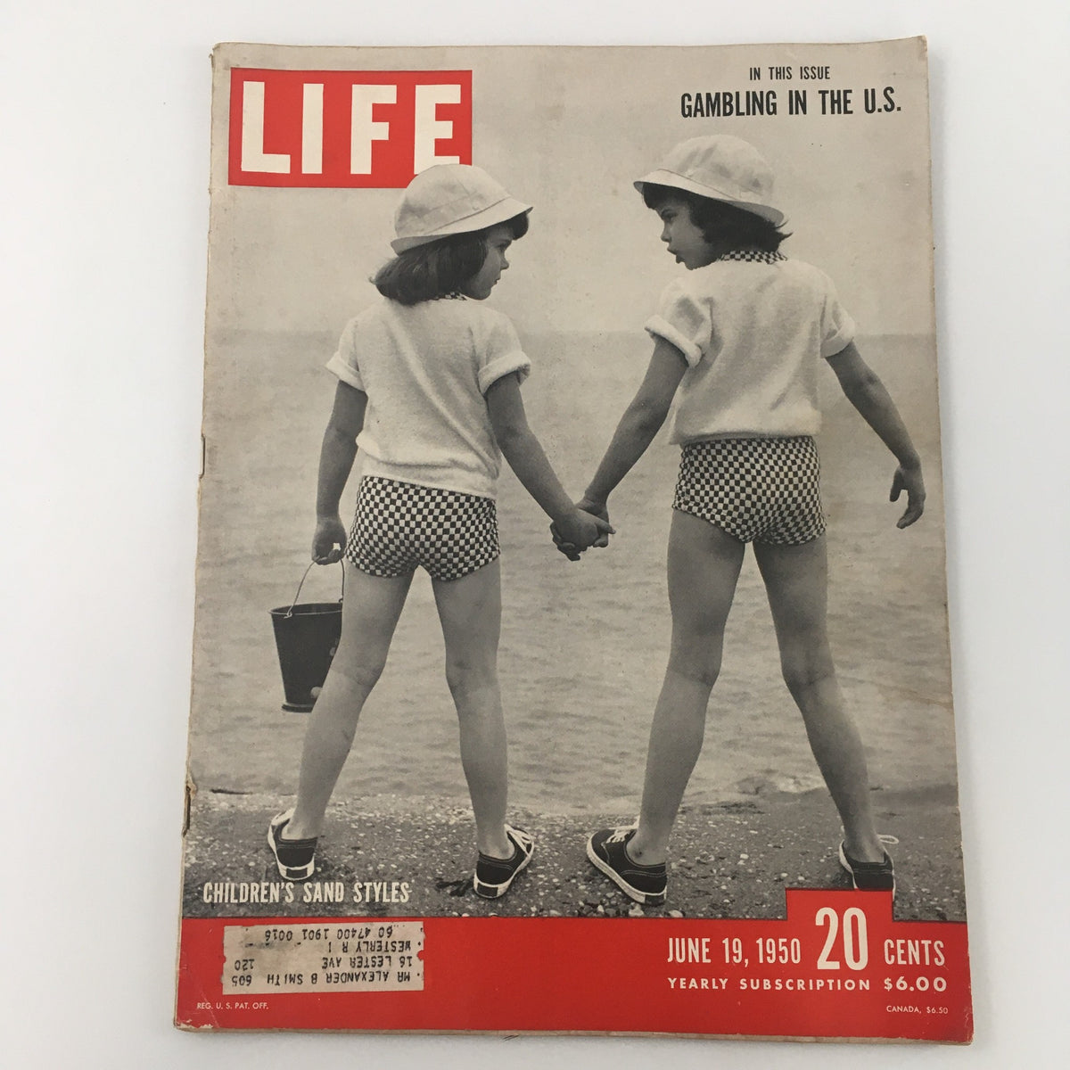 Vintage Life Magazine cover from June 19, 1950, featuring an article on Children's Sand Styles and Gambling in the U.S. The cover shows two children holding hands on the beach, showcasing 1950s fashion.