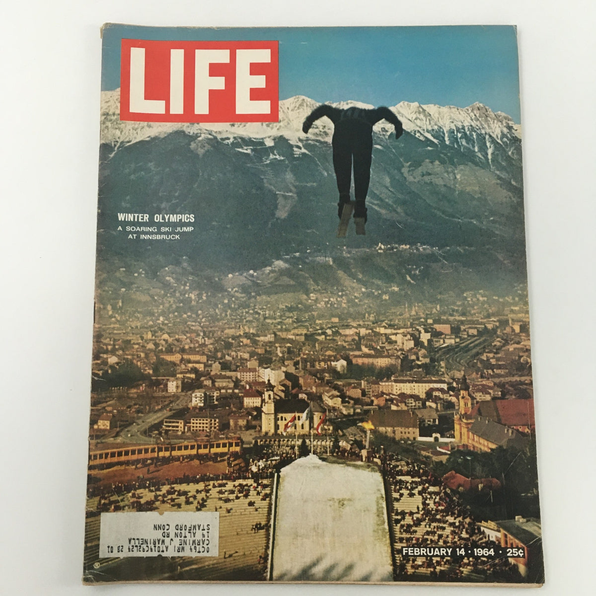VTG Life Magazine February 14 1964 cover featuring a ski jumper soaring at the Innsbruck Winter Olympics, showcasing the breathtaking winter sports atmosphere.
