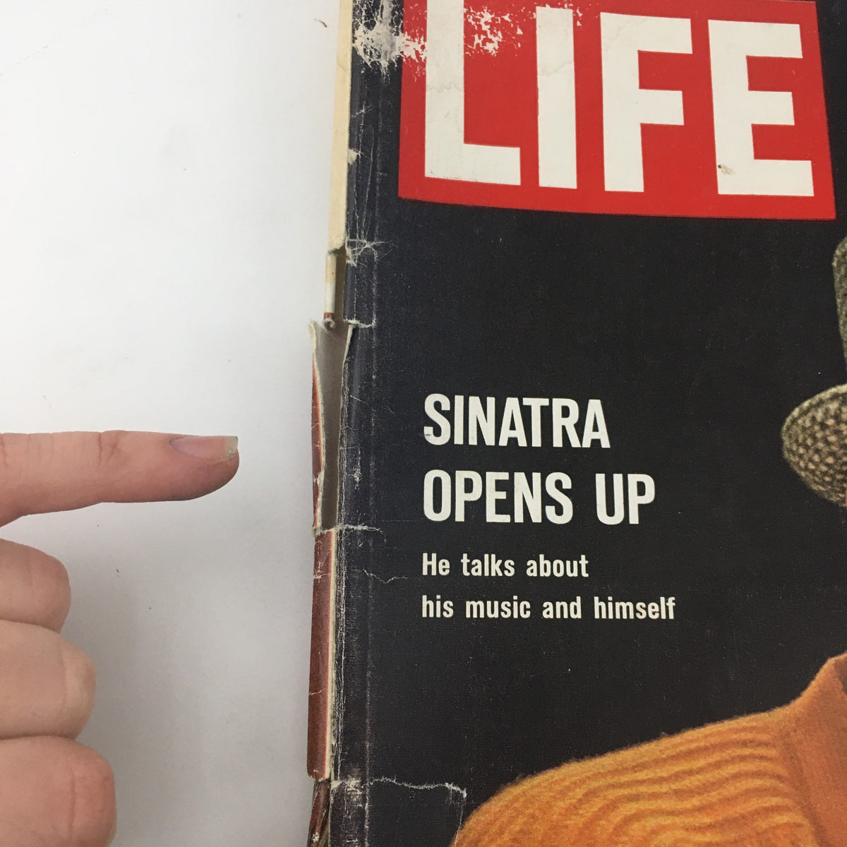 Close-up view of the cover of VTG Life Magazine from April 23, 1965, featuring the headline 'Sinatra Opens Up' and a brief description of Frank Sinatra discussing his music and personal life.